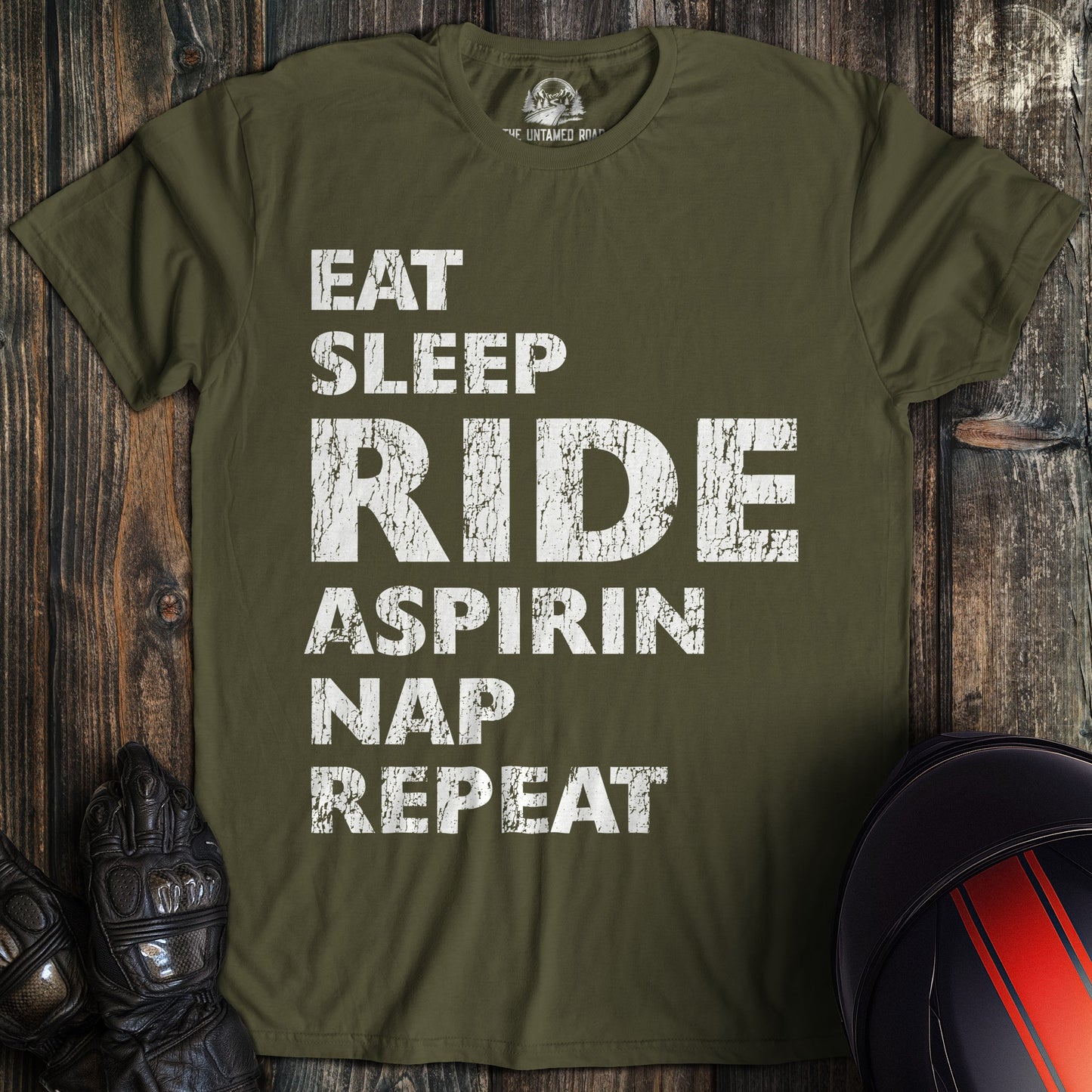 A military green colored t-shirt with the words "eat sleep ride" printed on the front.