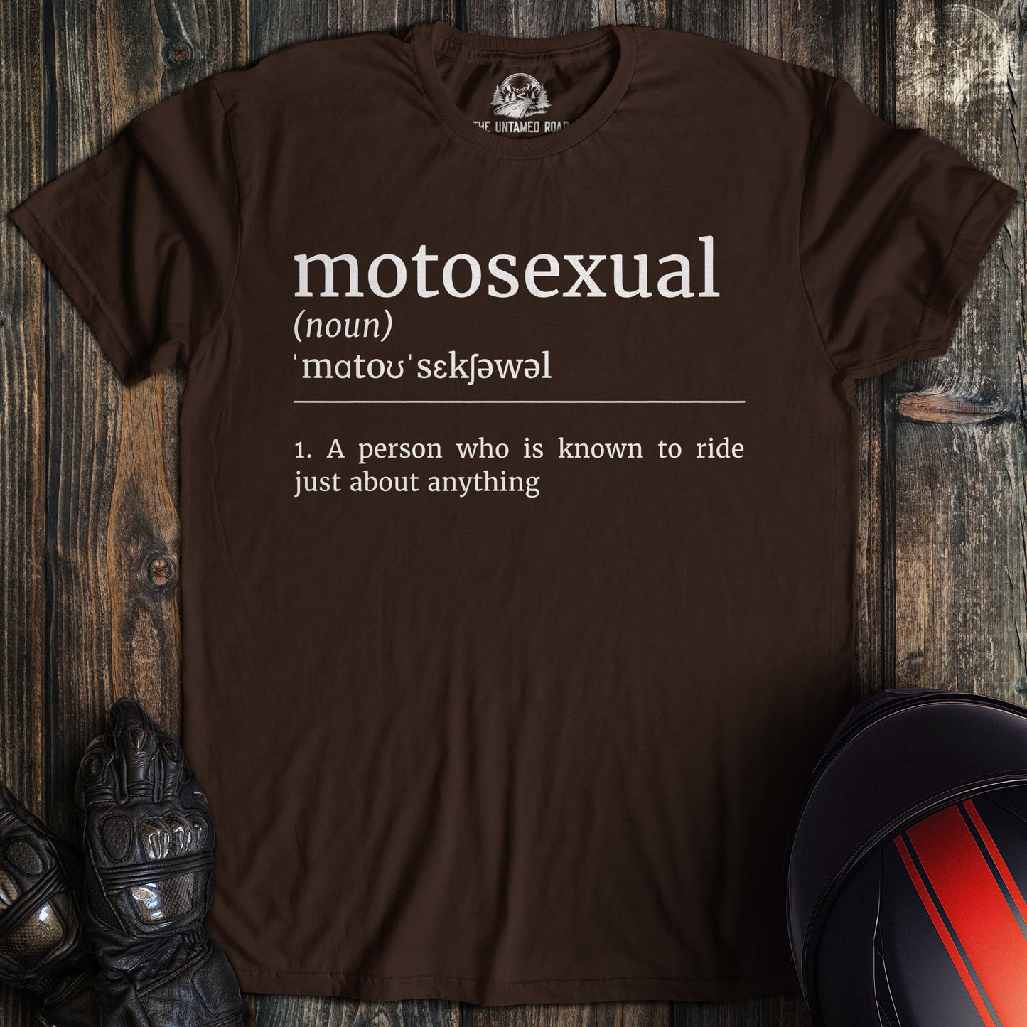 A dark chocolate colored t-shirt with the words "motosexual definition" printed on the front.