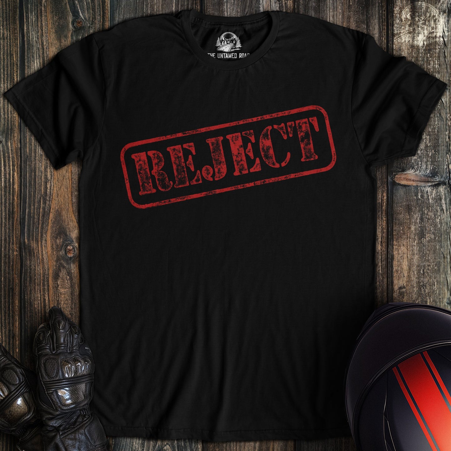 A black colored t-shirt with the words "reject" printed on the front.