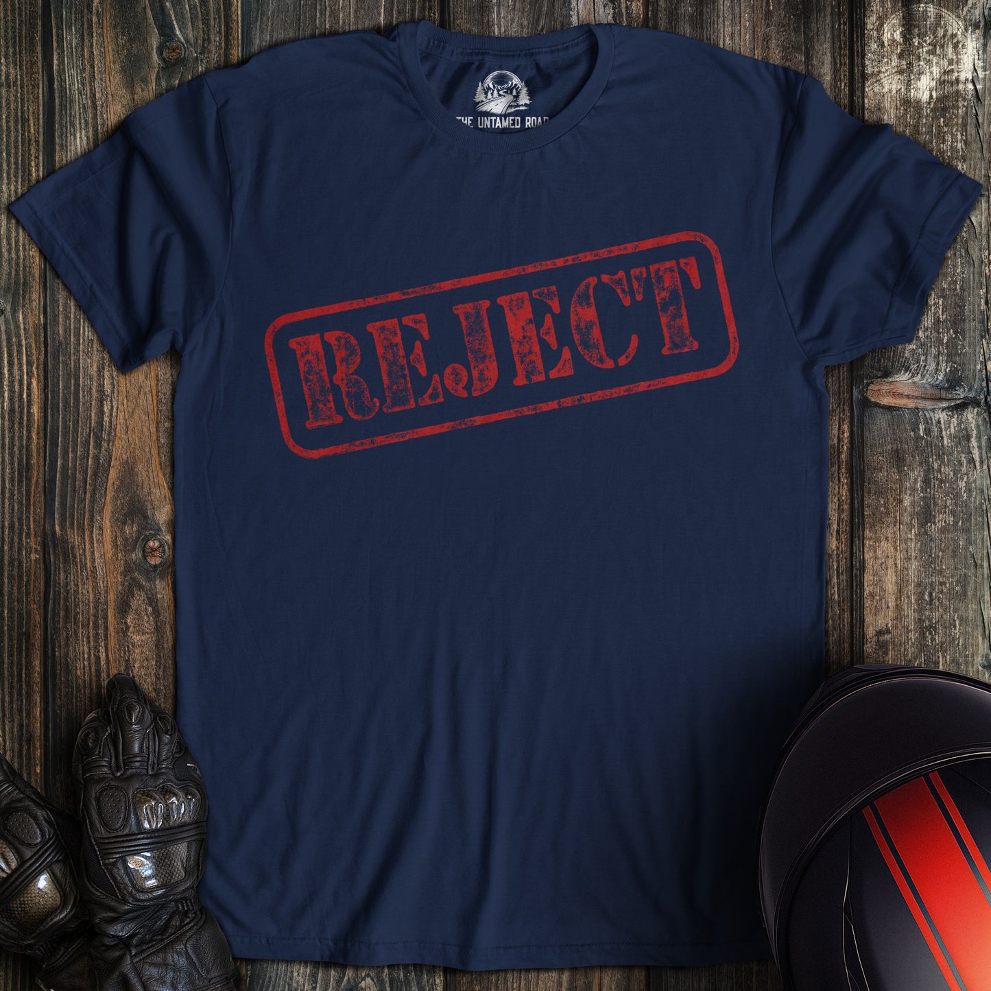 A navy colored t-shirt with the words "reject" printed on the front.