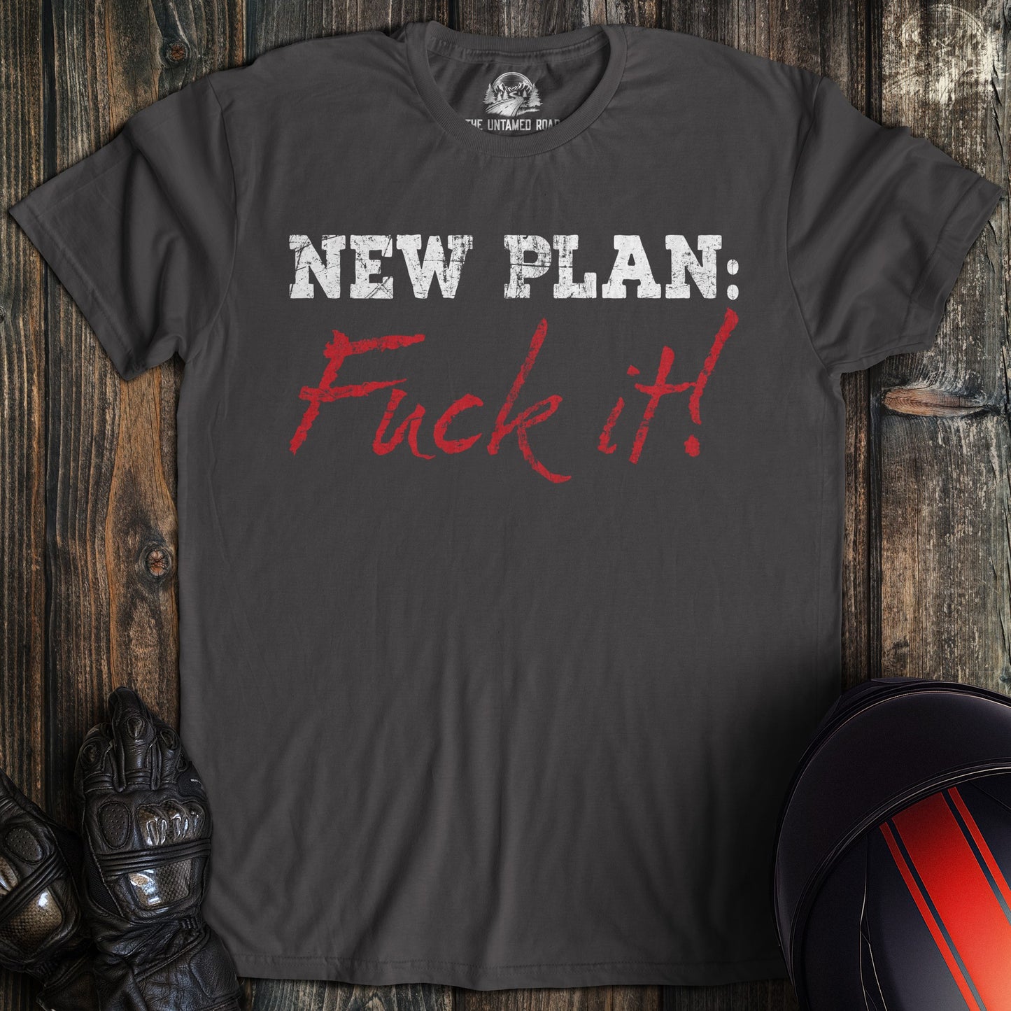 A charcoal colored t-shirt with the words "new plan" printed on the front.