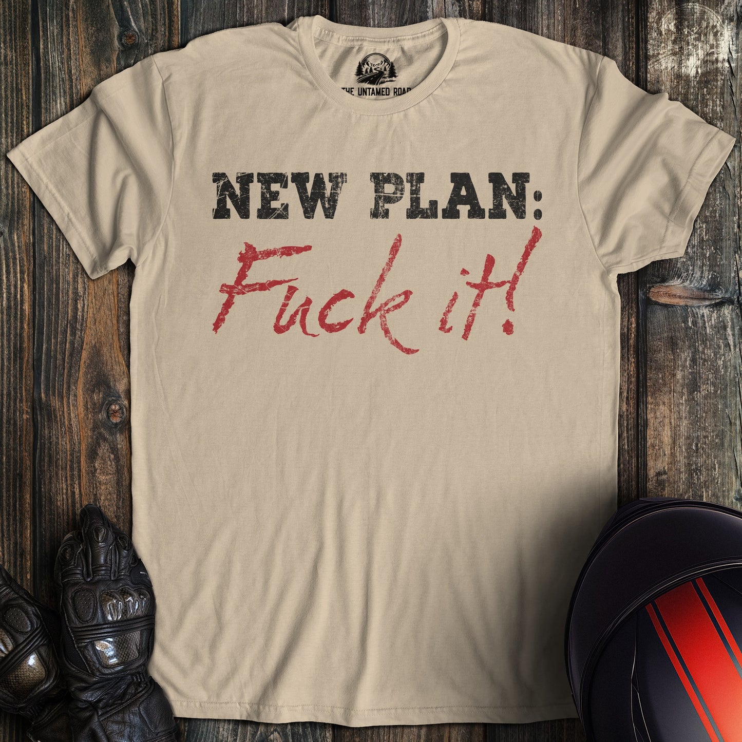 A sand colored t-shirt with the words "new plan" printed on the front.