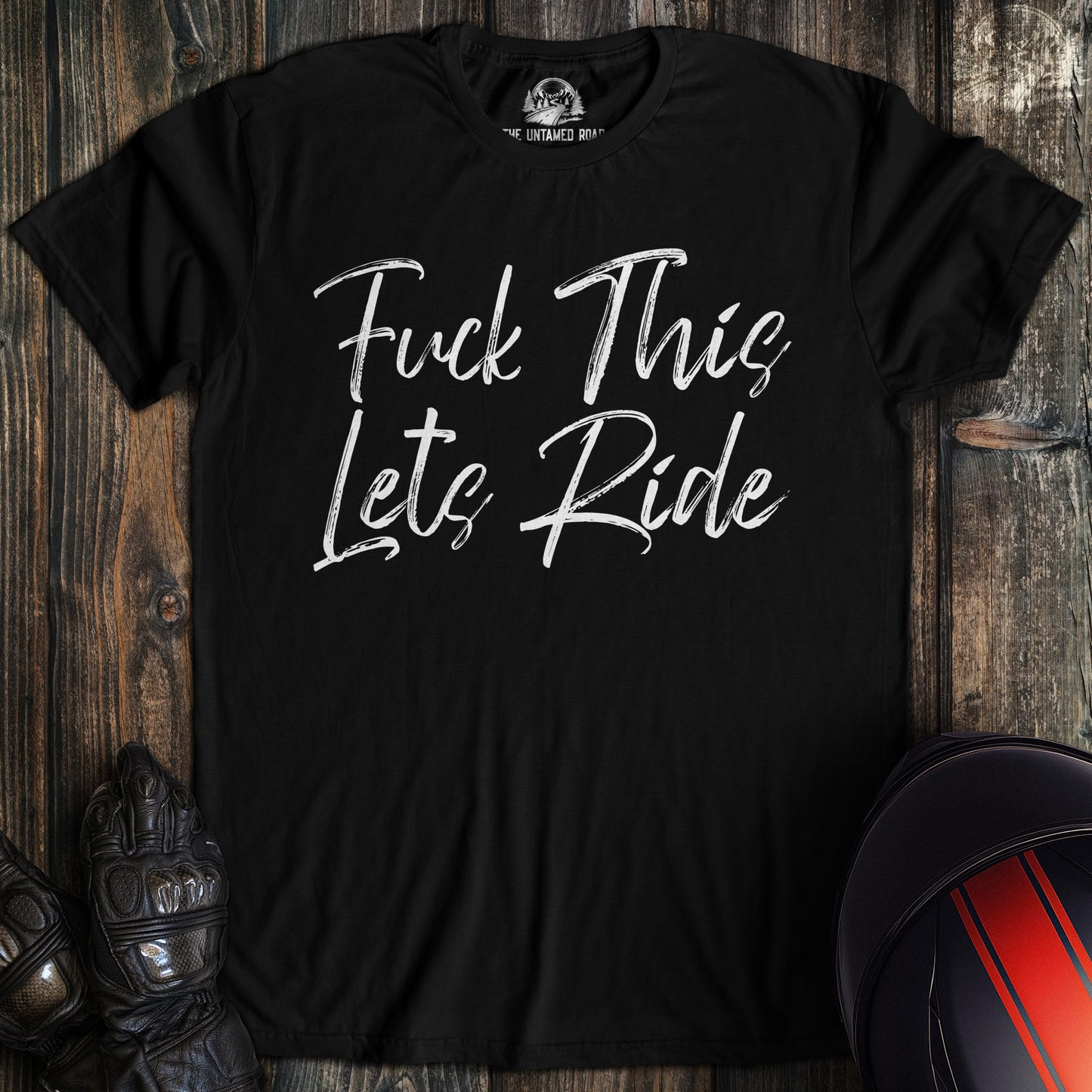 A black colored t-shirt with the words "fuck this lets ride" printed on the front.