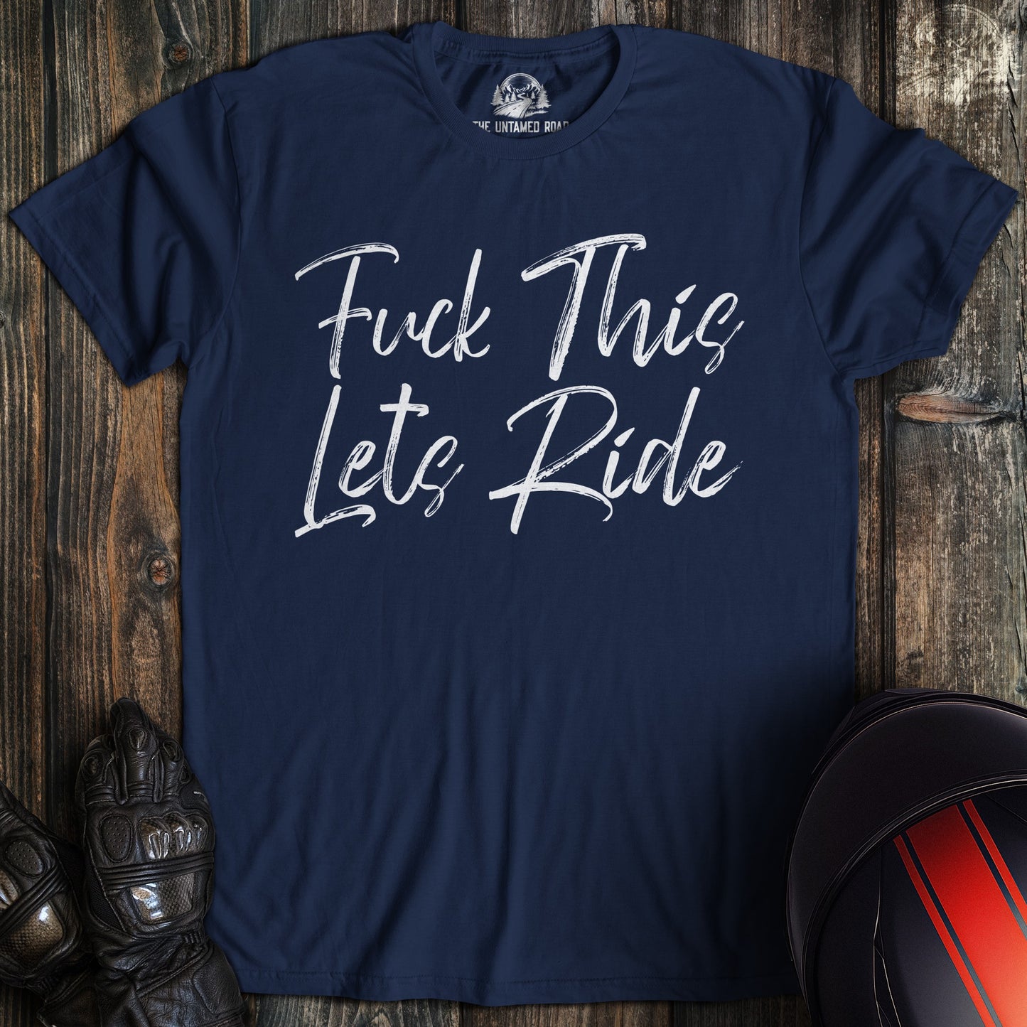 A navy colored t-shirt with the words "fuck this lets ride" printed on the front.