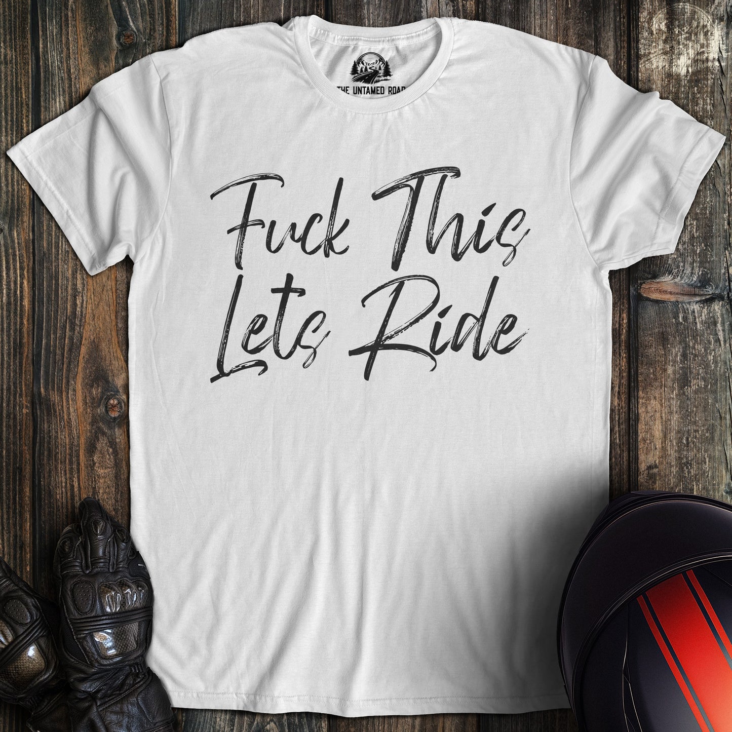 A white colored t-shirt with the words "fuck this lets ride" printed on the front.