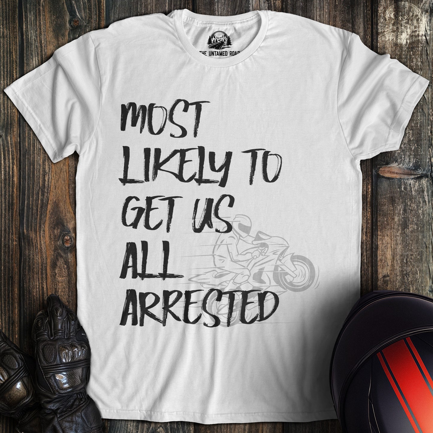 A white colored t-shirt with the words "most likely to get us arrested" printed on the front.
