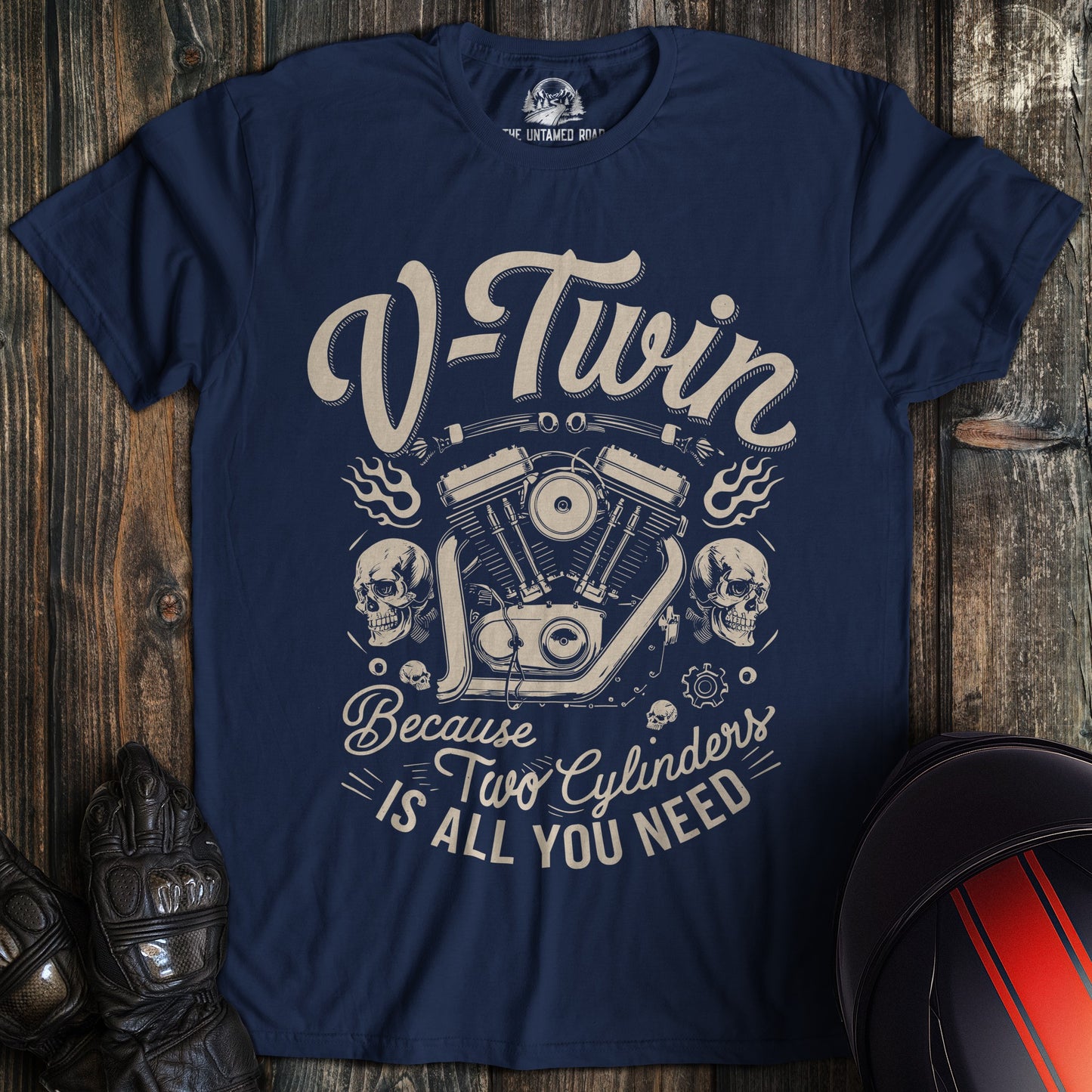 A navy colored t-shirt with the words "two cylinders all you need" printed on the front.