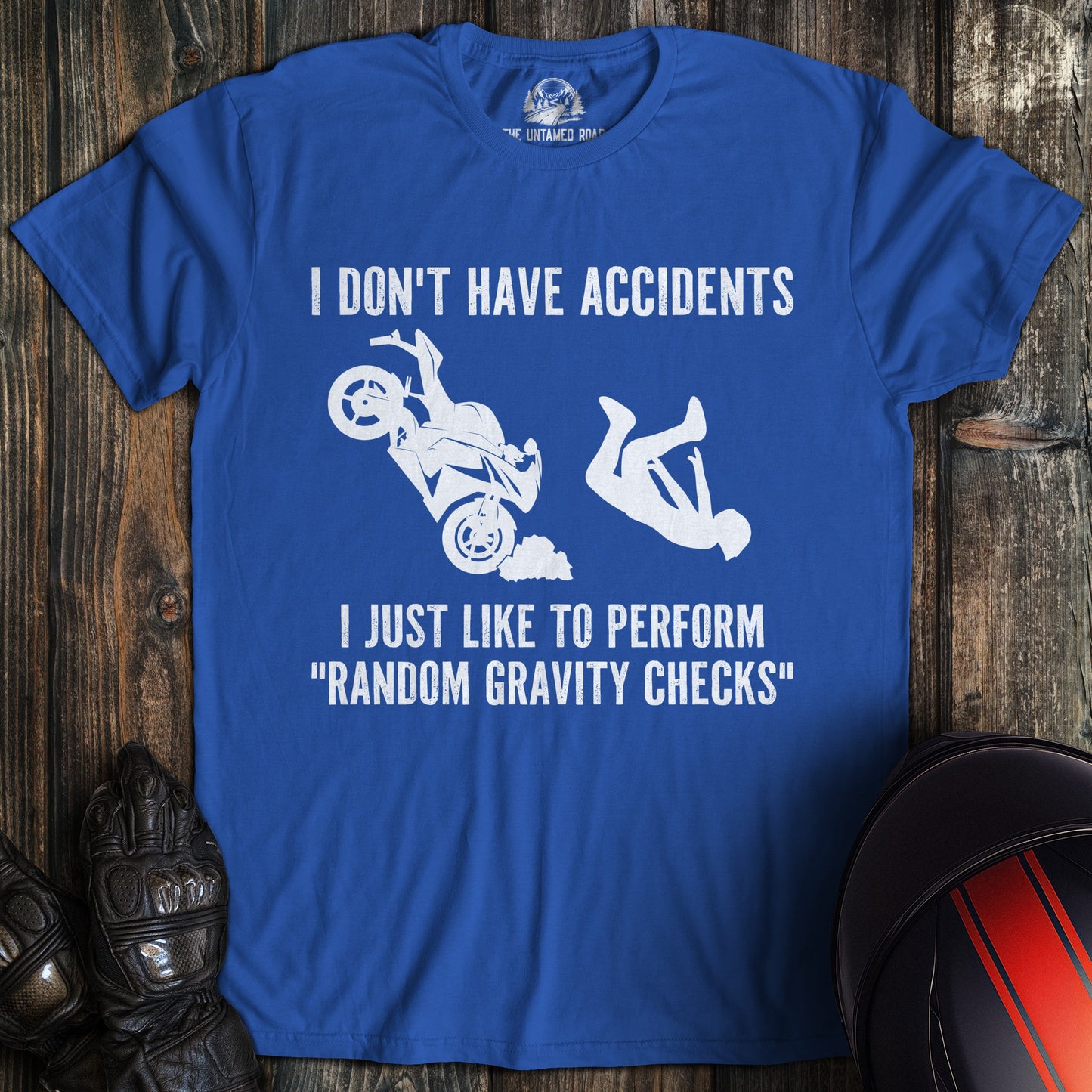 A royal blue colored t-shirt with the words "random gravity checks" printed on the front.