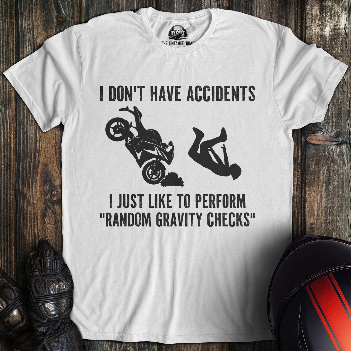 A white colored t-shirt with the words "random gravity checks" printed on the front.