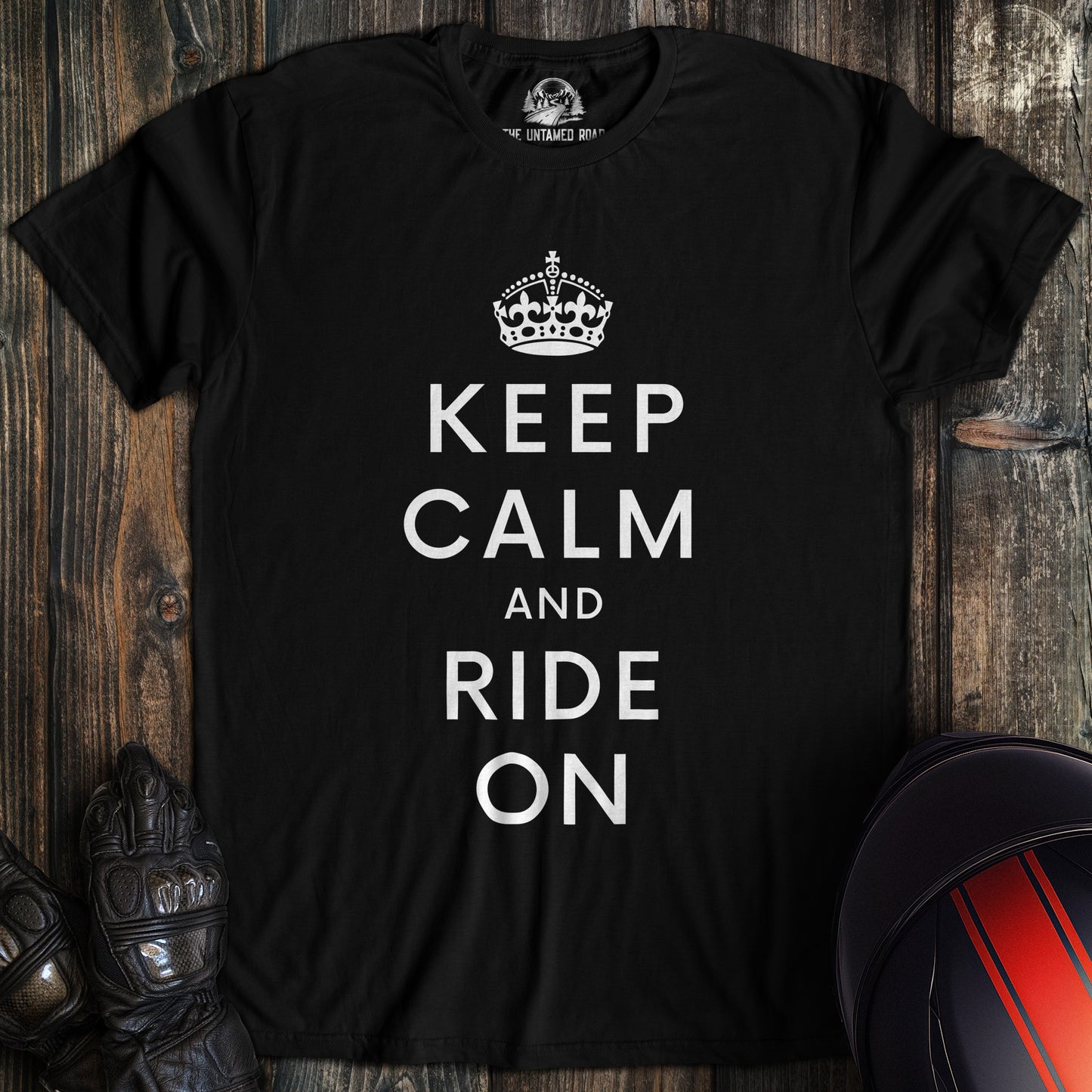 A black colored t-shirt with the words "keep calm" printed on the front.
