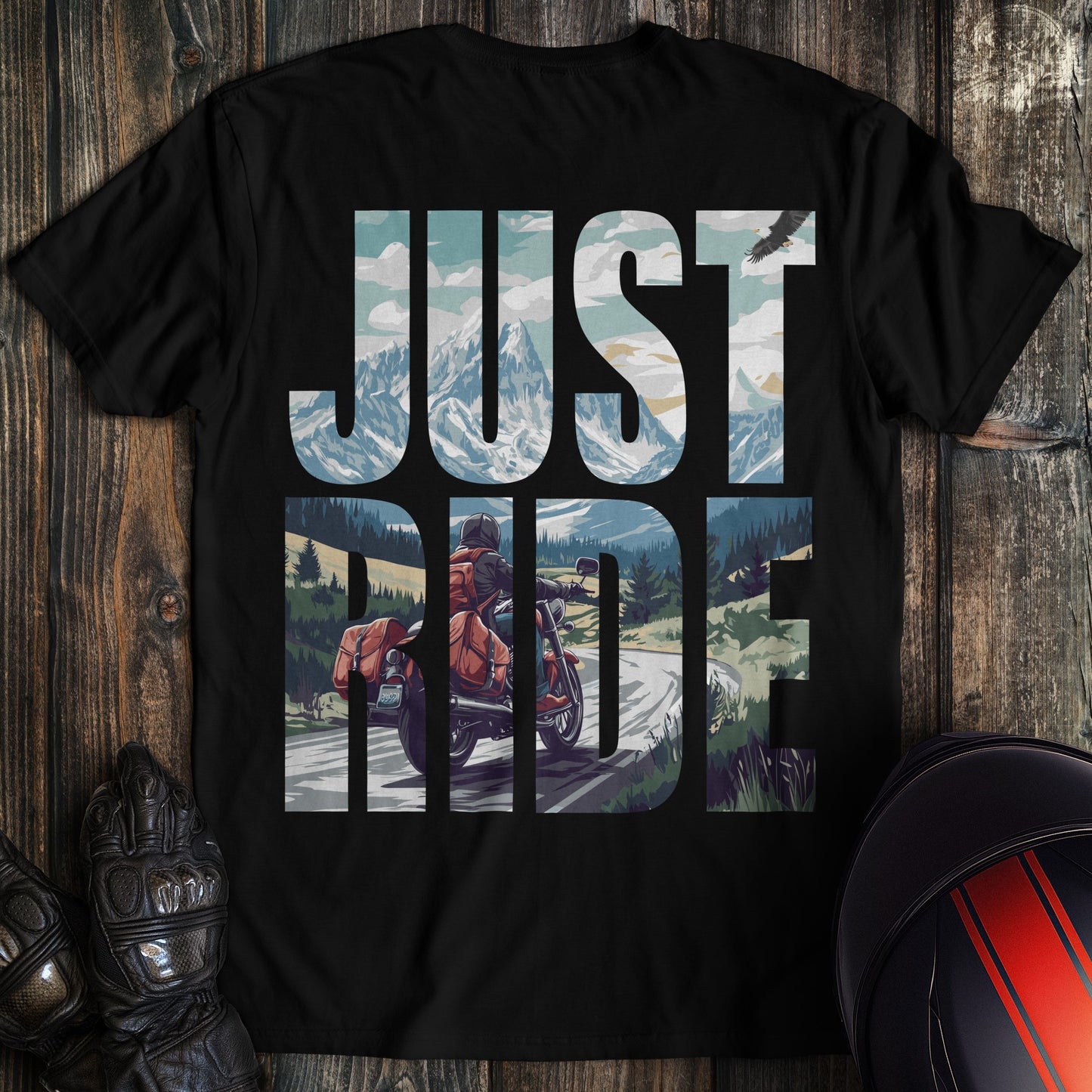 A black colored t-shirt with the words "just ride" printed on the back.
