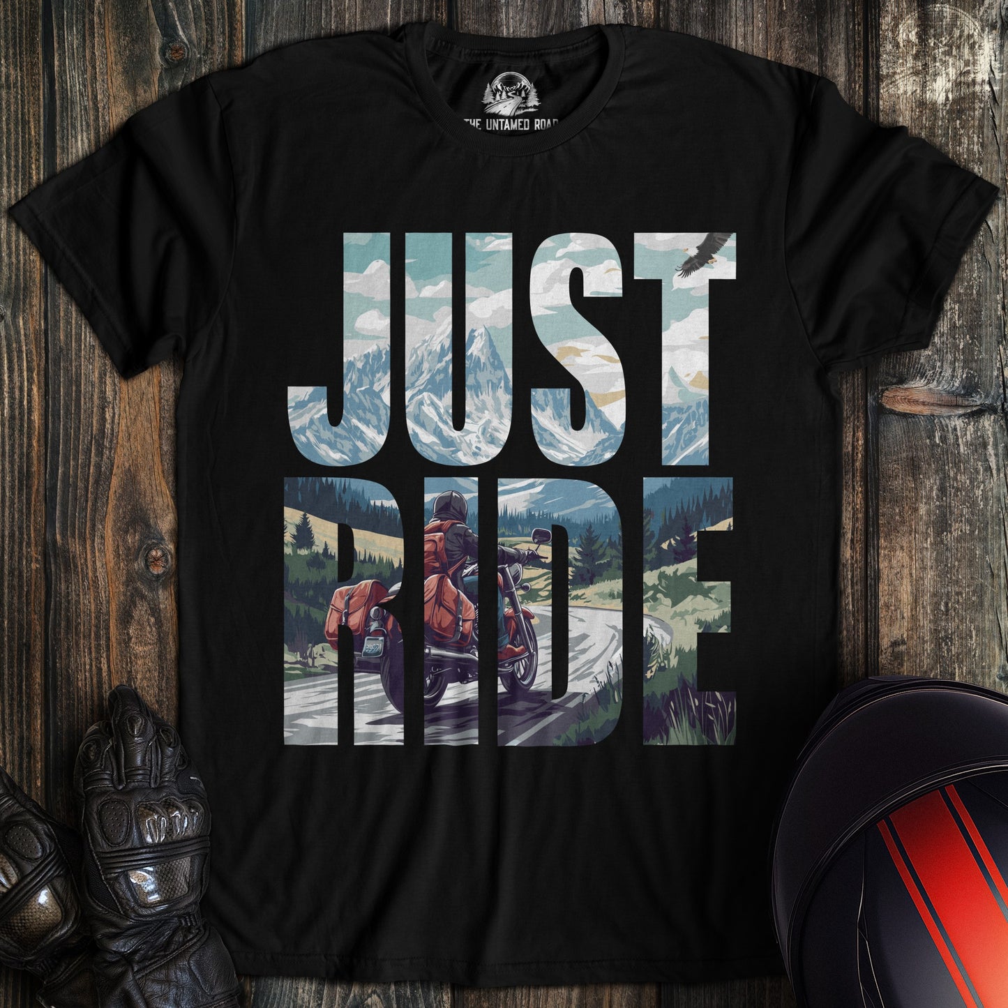 A black colored t-shirt with the words "just ride" printed on the front.