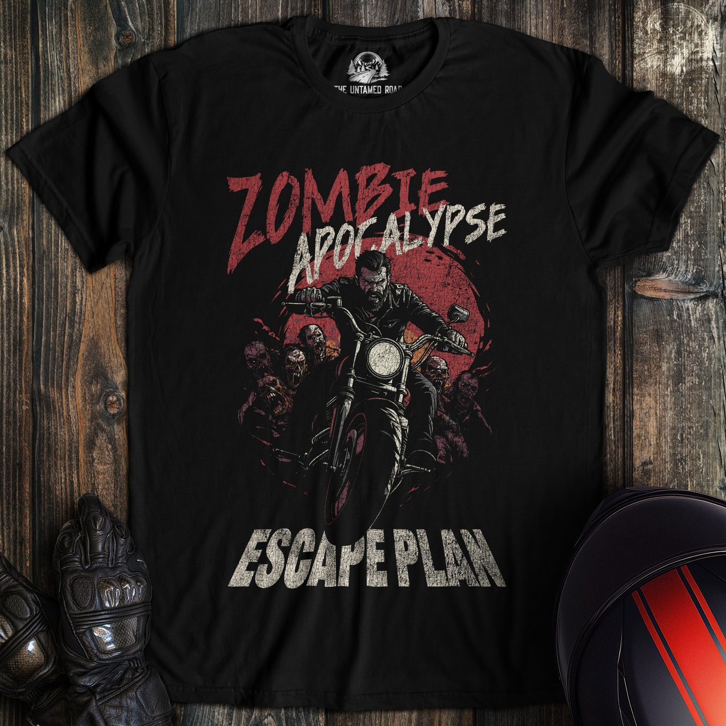 A black colored t-shirt with the words "zombie apocalypse" printed on the front.