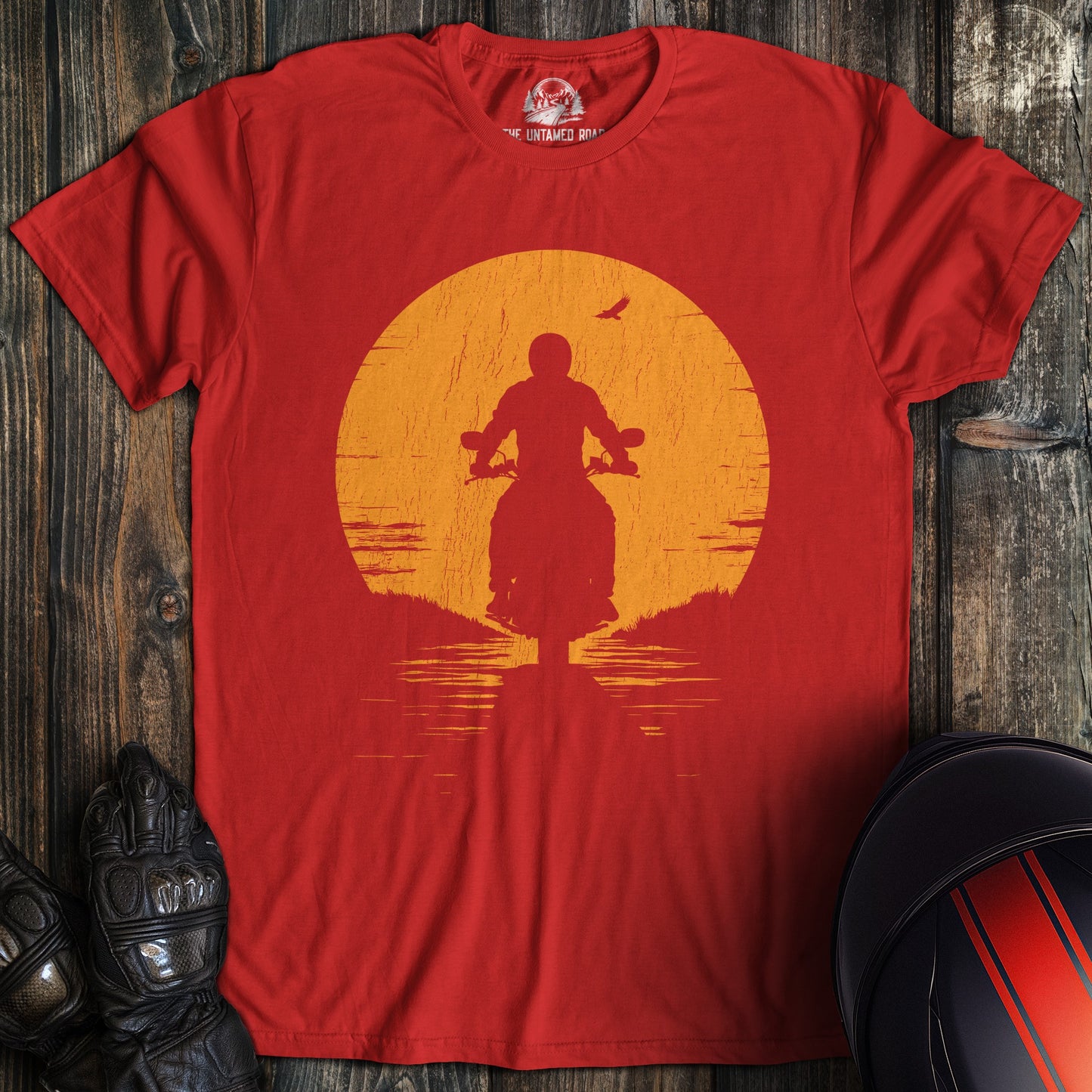 A red colored t-shirt with the words "sunset" printed on the front.