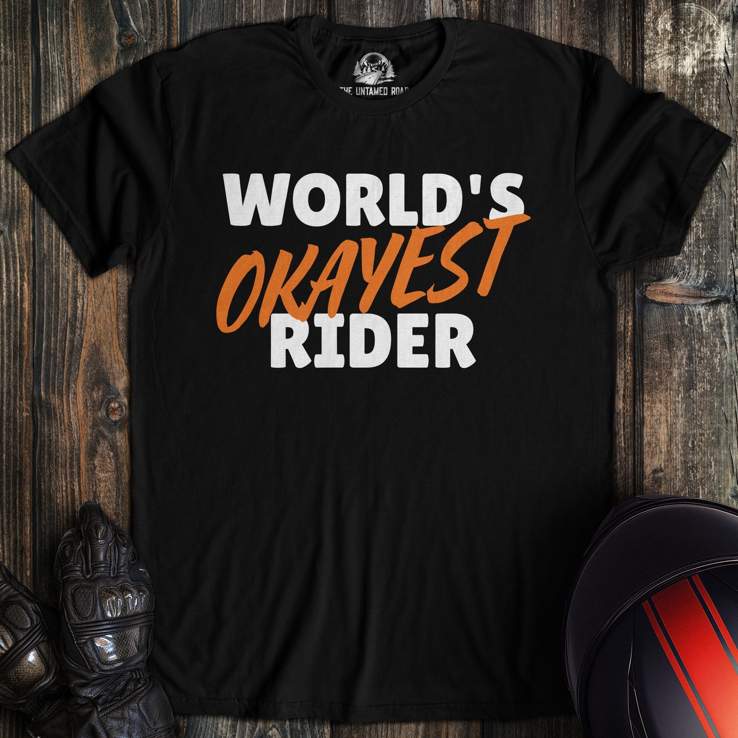 A black colored t-shirt with the words "worlds okayest rider" printed on the front.