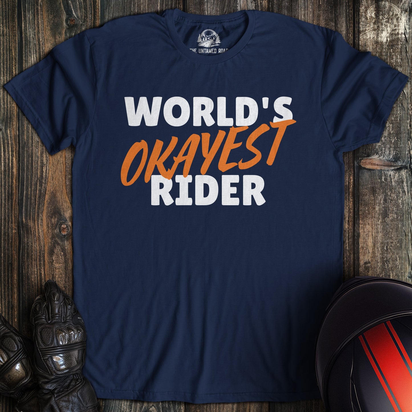 A navy colored t-shirt with the words "worlds okayest rider" printed on the front.