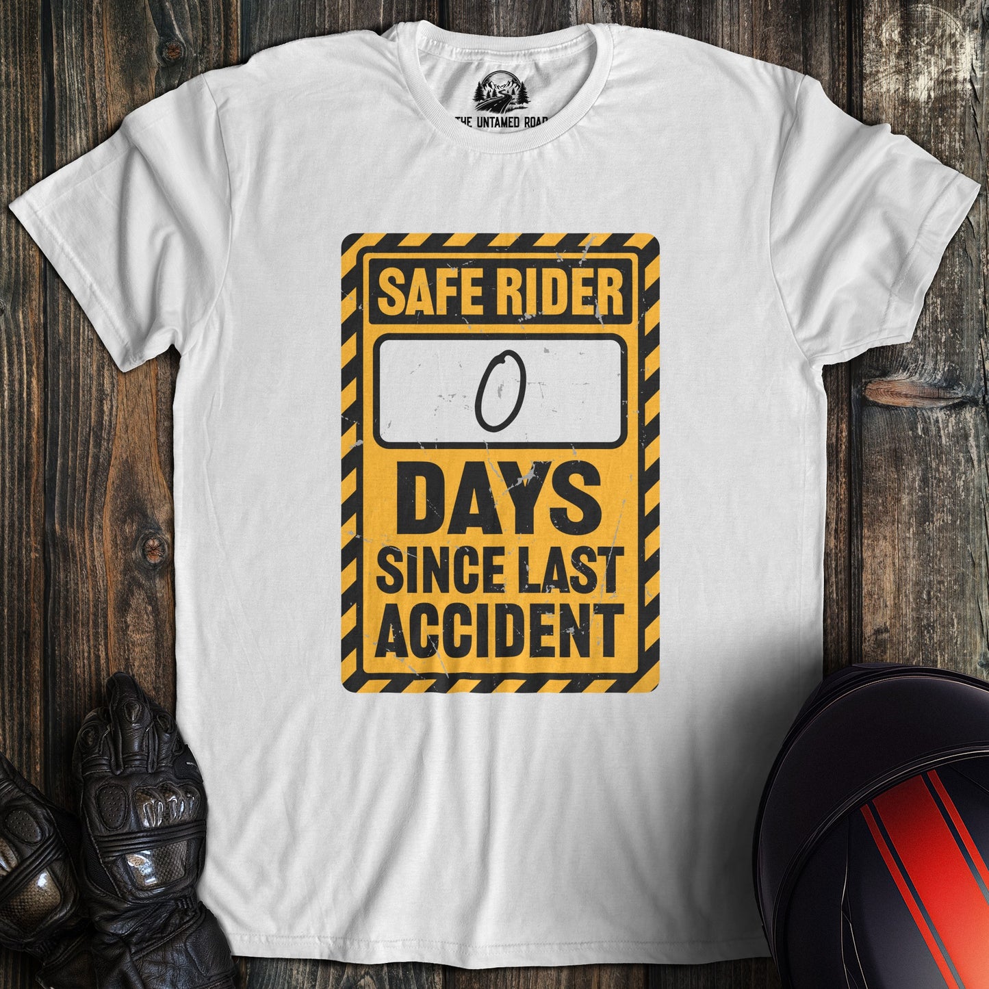 A white colored t-shirt with the words "zero days since accident" printed on the front.