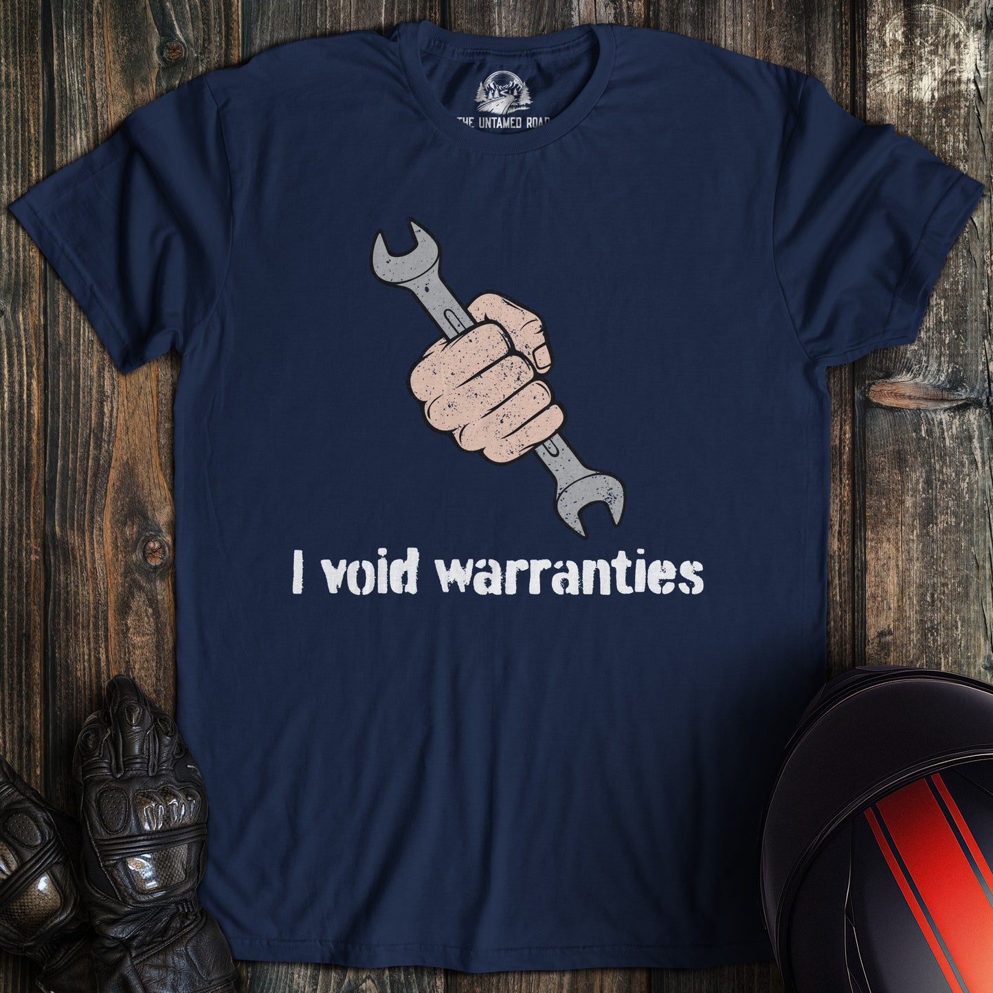 A navy colored t-shirt with the words "ivoid warranties" printed on the front.
