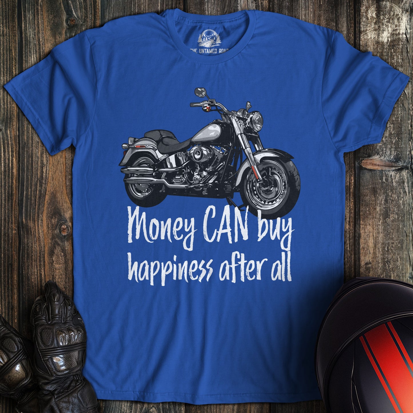 A royal blue colored t-shirt with the words "money can buy happiness" printed on the front.