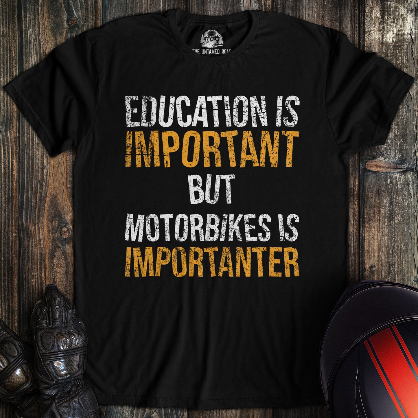 A black colored t-shirt with the words "education is important" printed on the front.