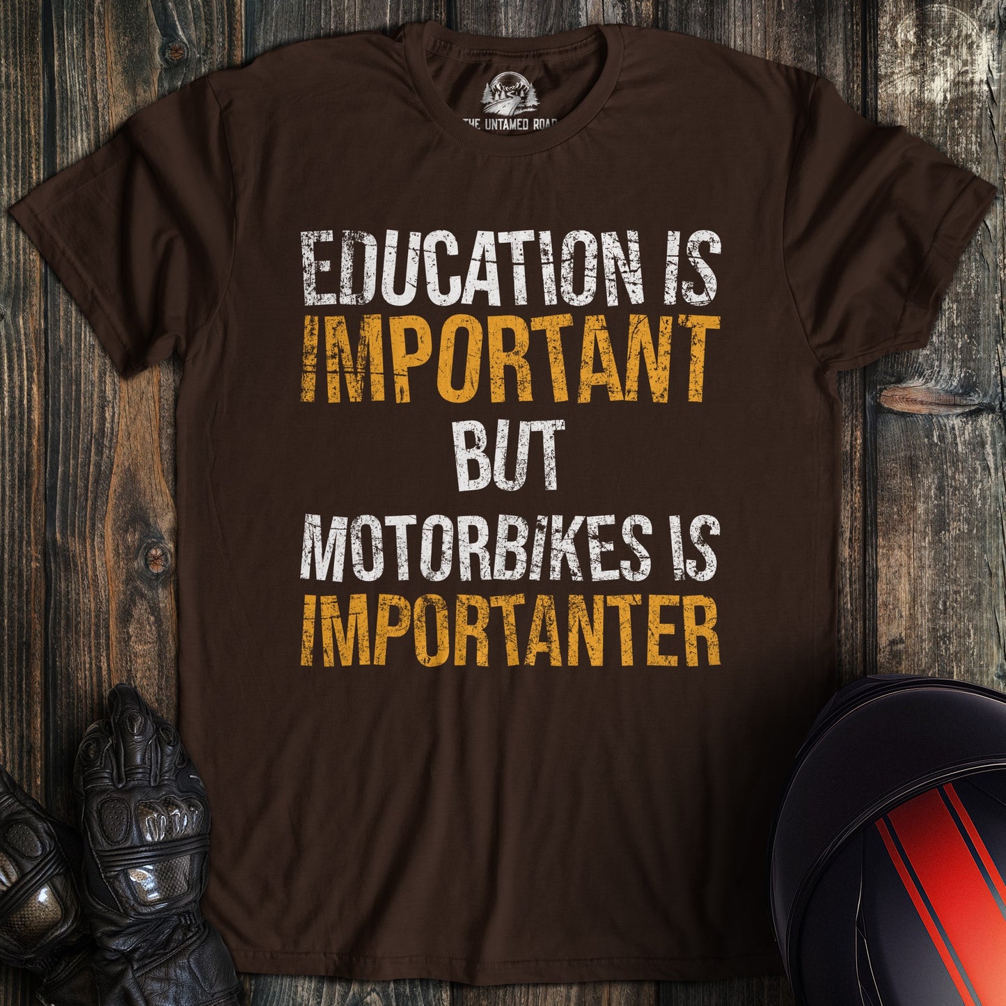 A dark chocolate colored t-shirt with the words "education is important" printed on the front.