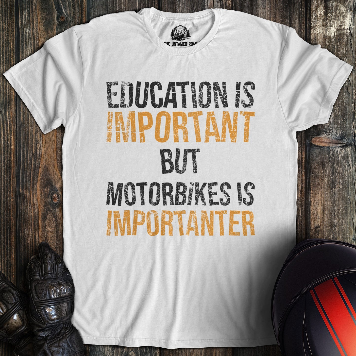 A white colored t-shirt with the words "education is important" printed on the front.