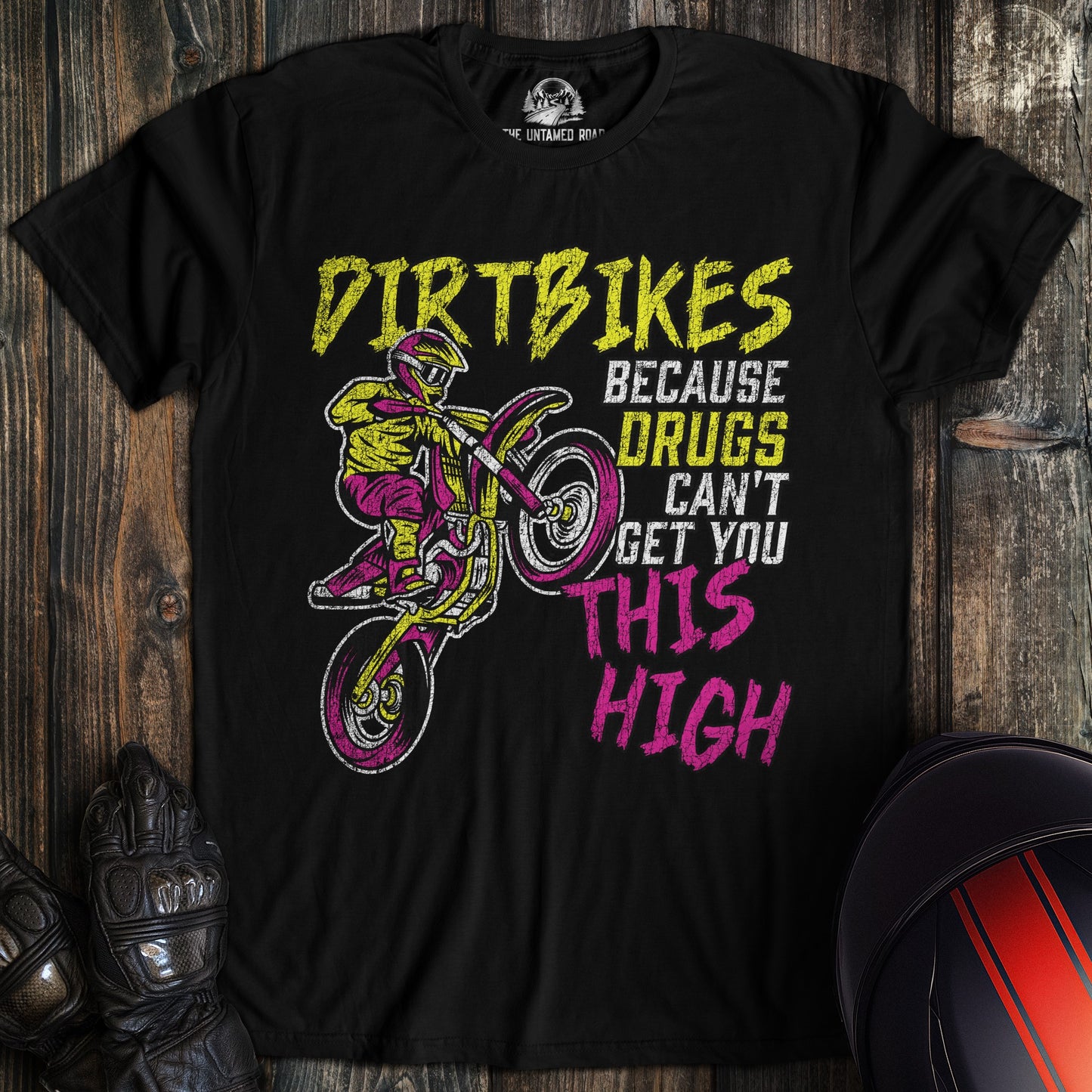 A black colored t-shirt with the words "motocross drugs" printed on the front.