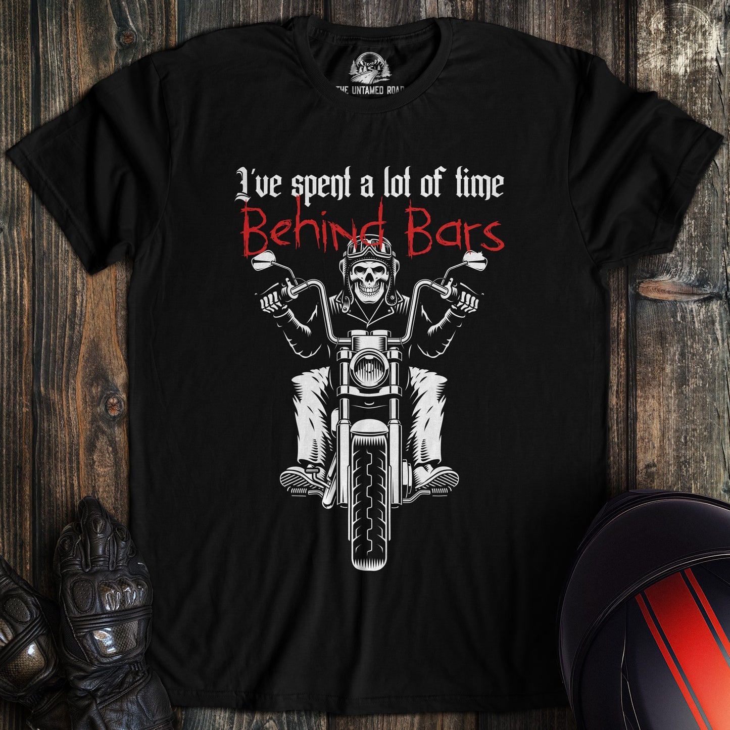A black colored t-shirt with the words "time behind bars" printed on the front.