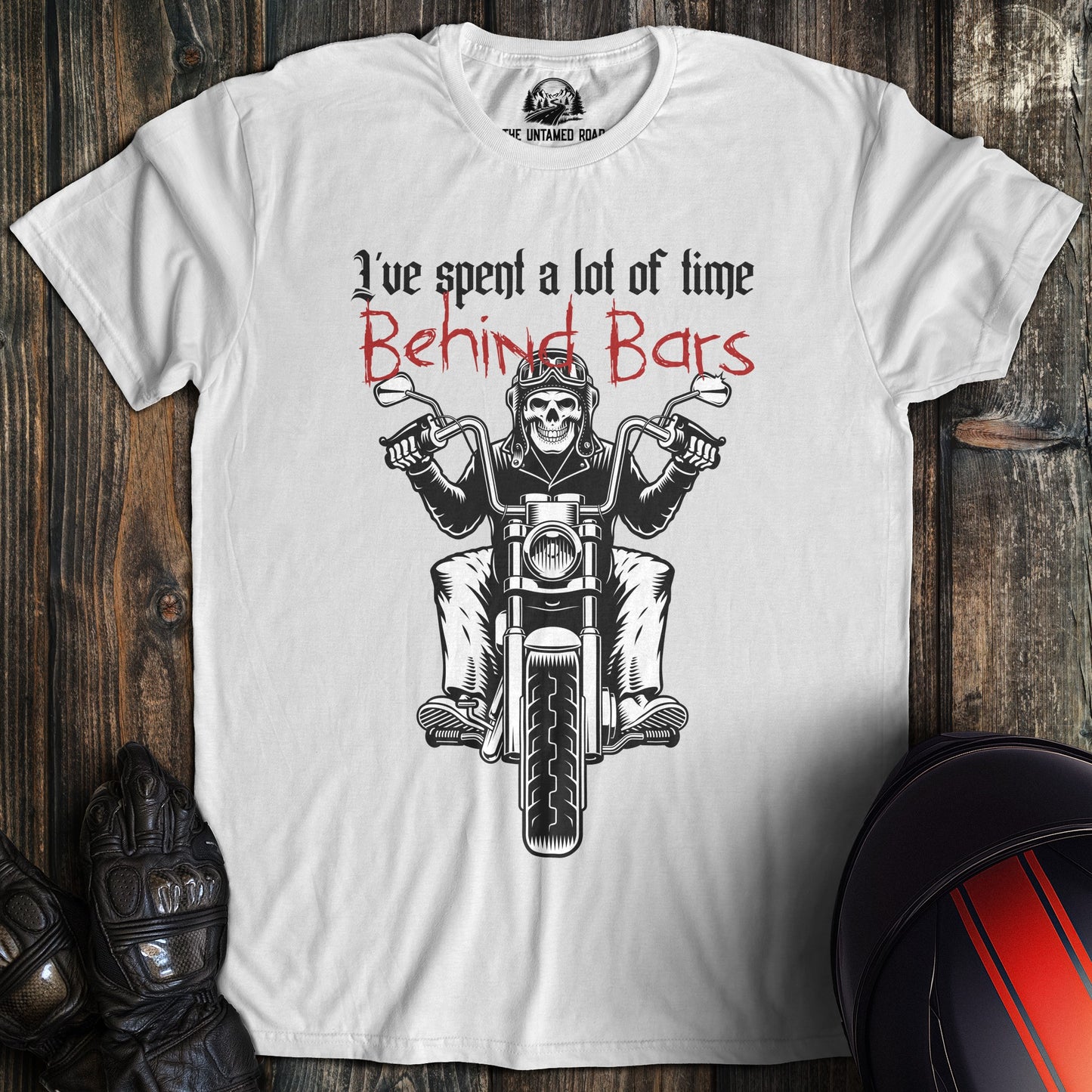 A white colored t-shirt with the words "time behind bars" printed on the front.