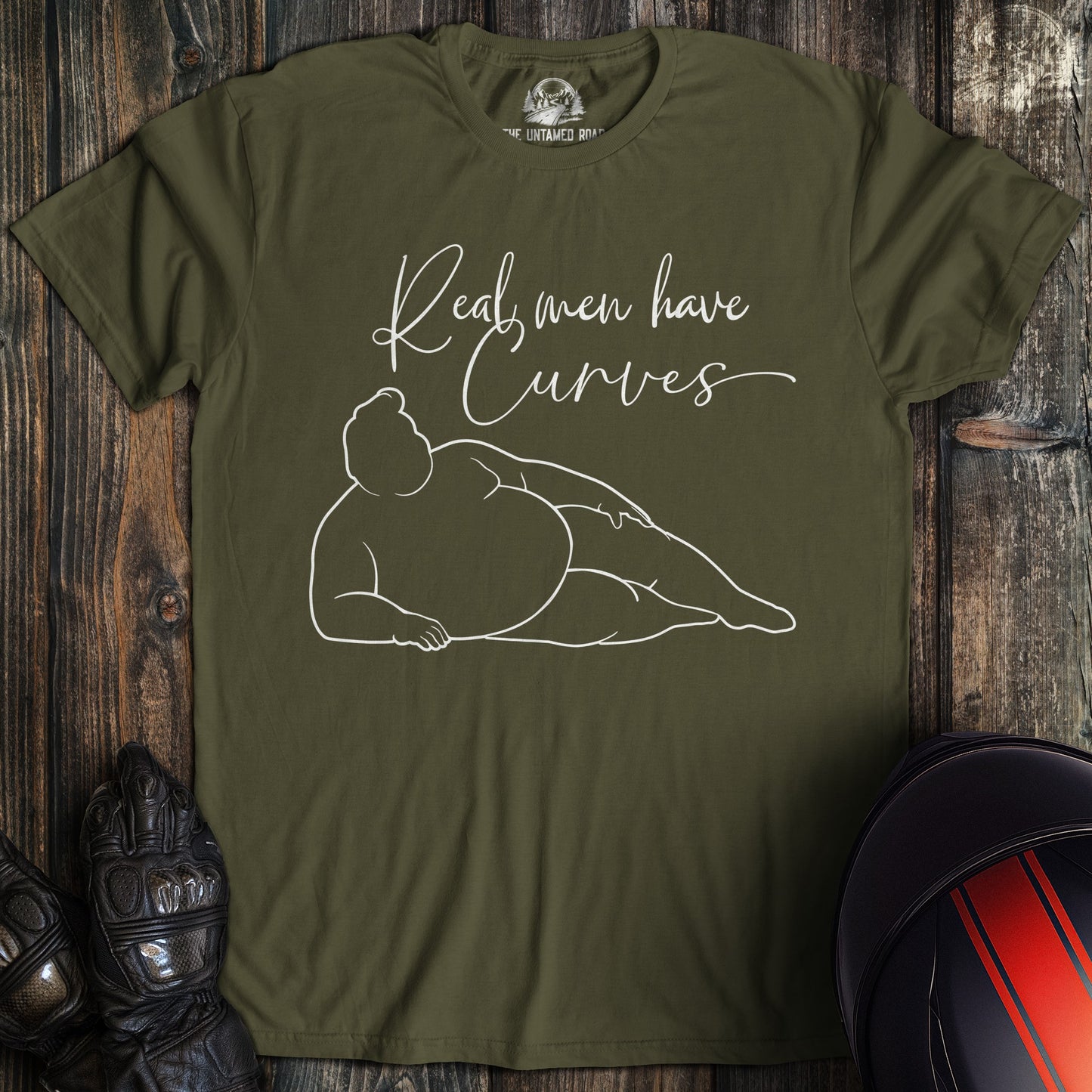 A military green colored t-shirt with the words "real men have curves" printed on the front.