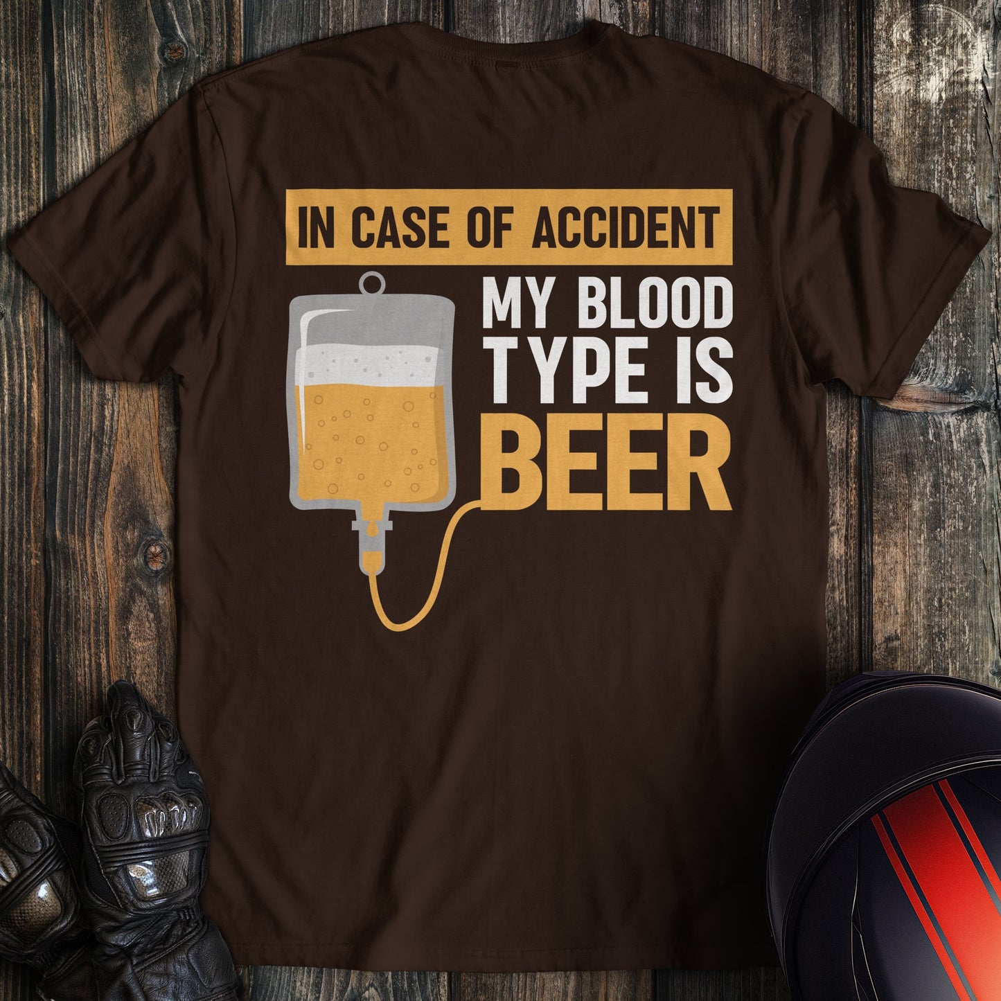 A dark chocolate colored t-shirt with the words "blood type beer" printed on the back.