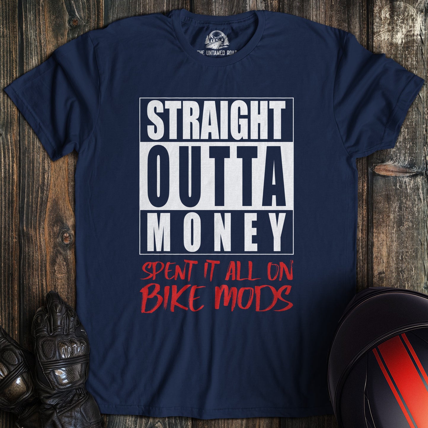 A navy colored t-shirt with the words "straight outta money" printed on the front.