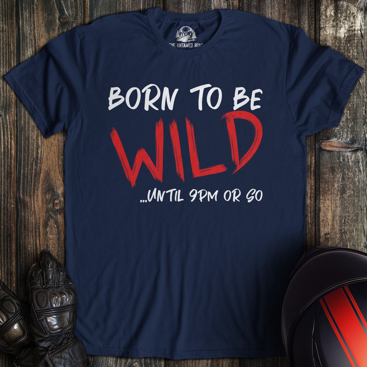 A navy colored t-shirt with the words "born to be wild" printed on the front.