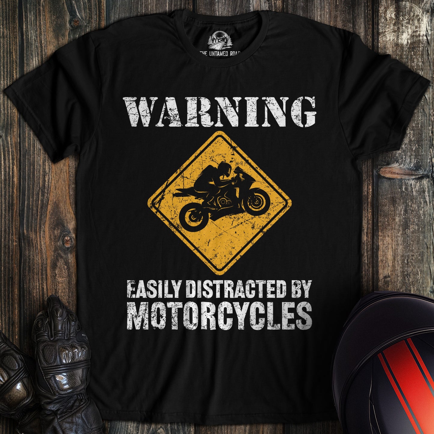 A black colored t-shirt with the words "easily distracted" printed on the front.