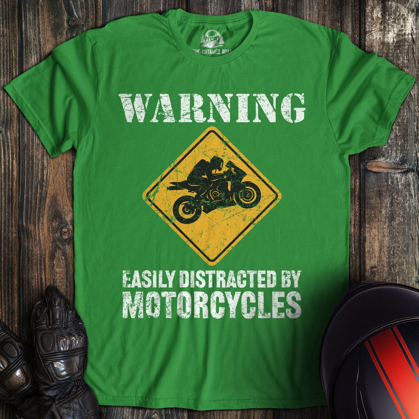 A irish green colored t-shirt with the words "easily distracted" printed on the front.