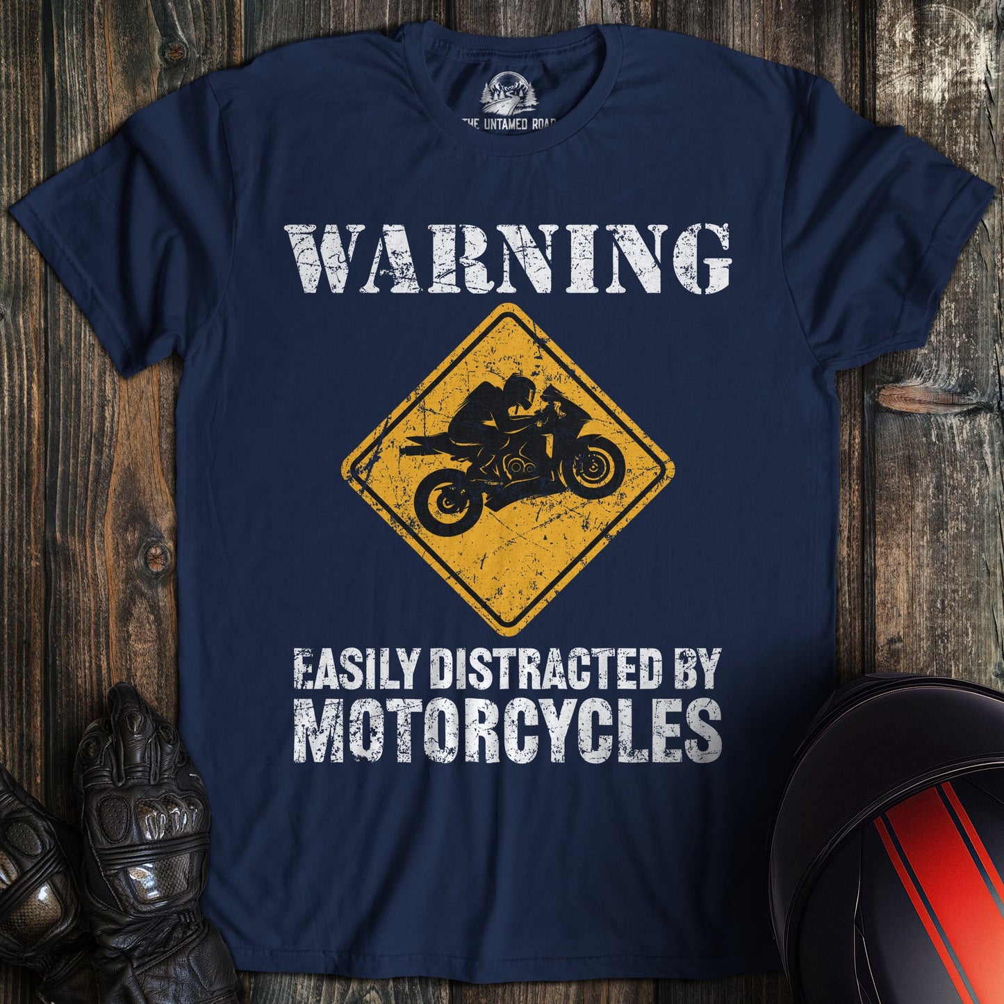 A navy colored t-shirt with the words "easily distracted" printed on the front.