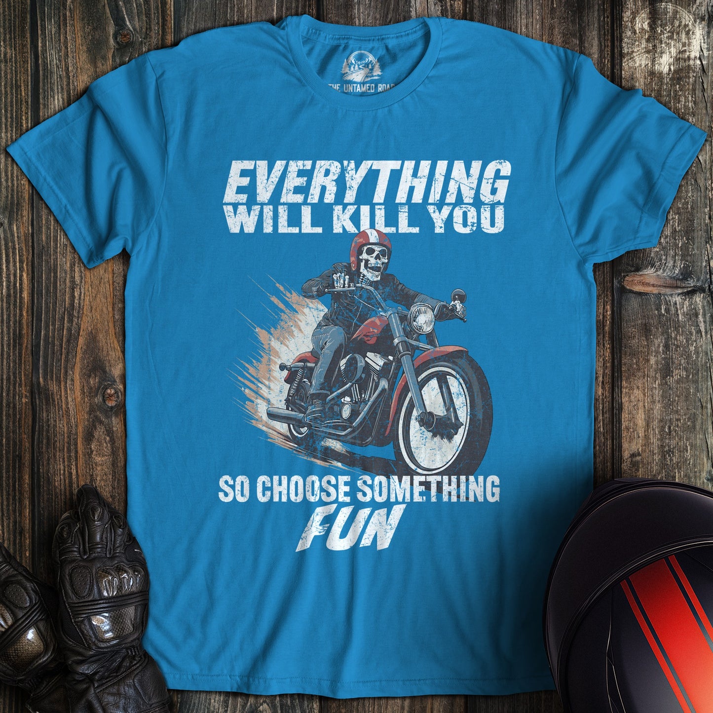 A sapphire blue colored t-shirt with the words "everything will kill you" printed on the front.