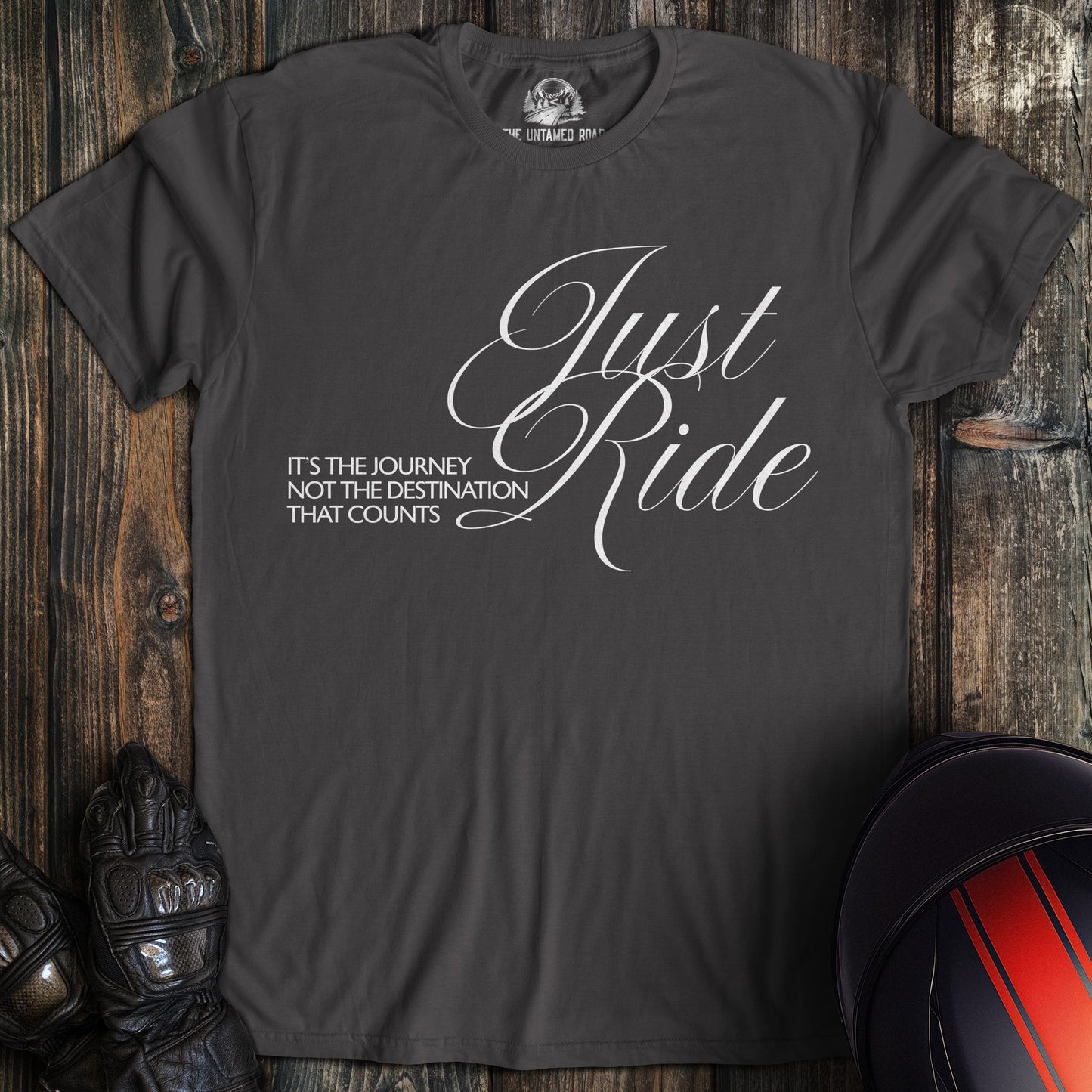 A charcoal colored t-shirt with the words "journey not destination" printed on the front.