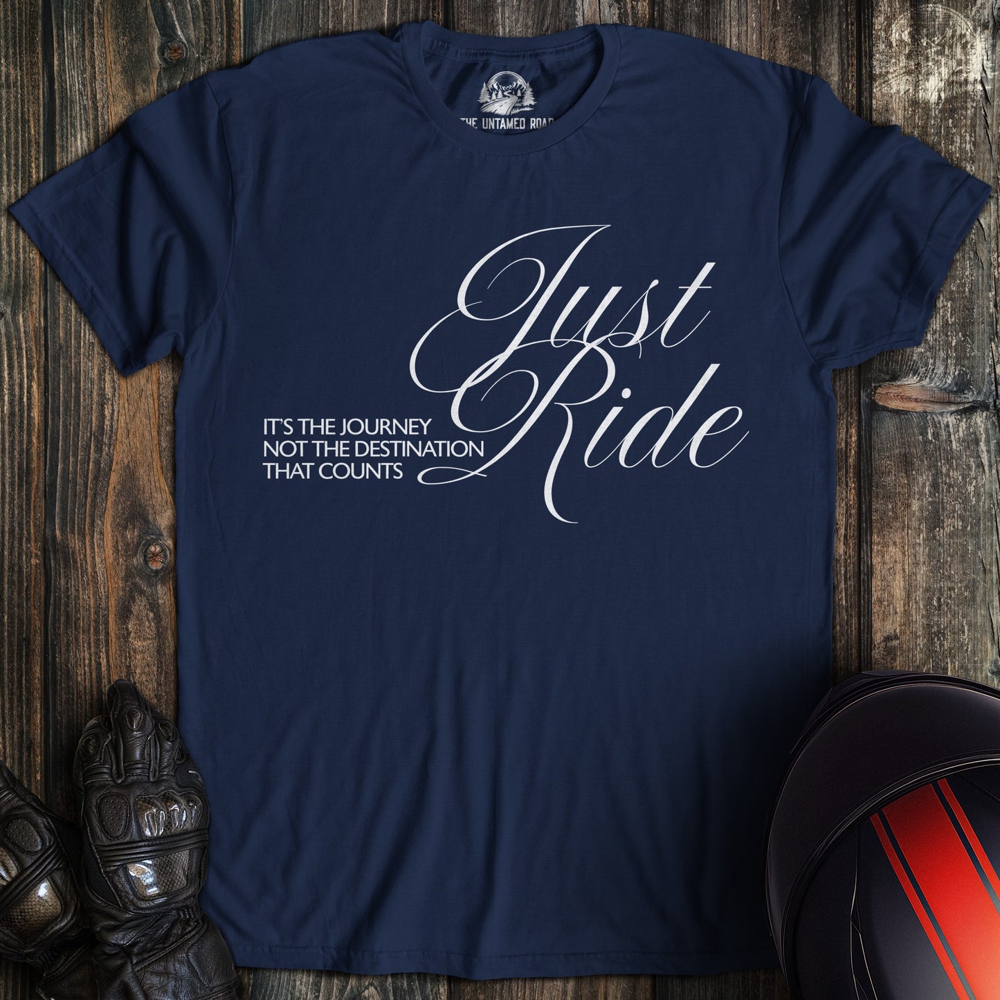 A navy colored t-shirt with the words "journey not destination" printed on the front.