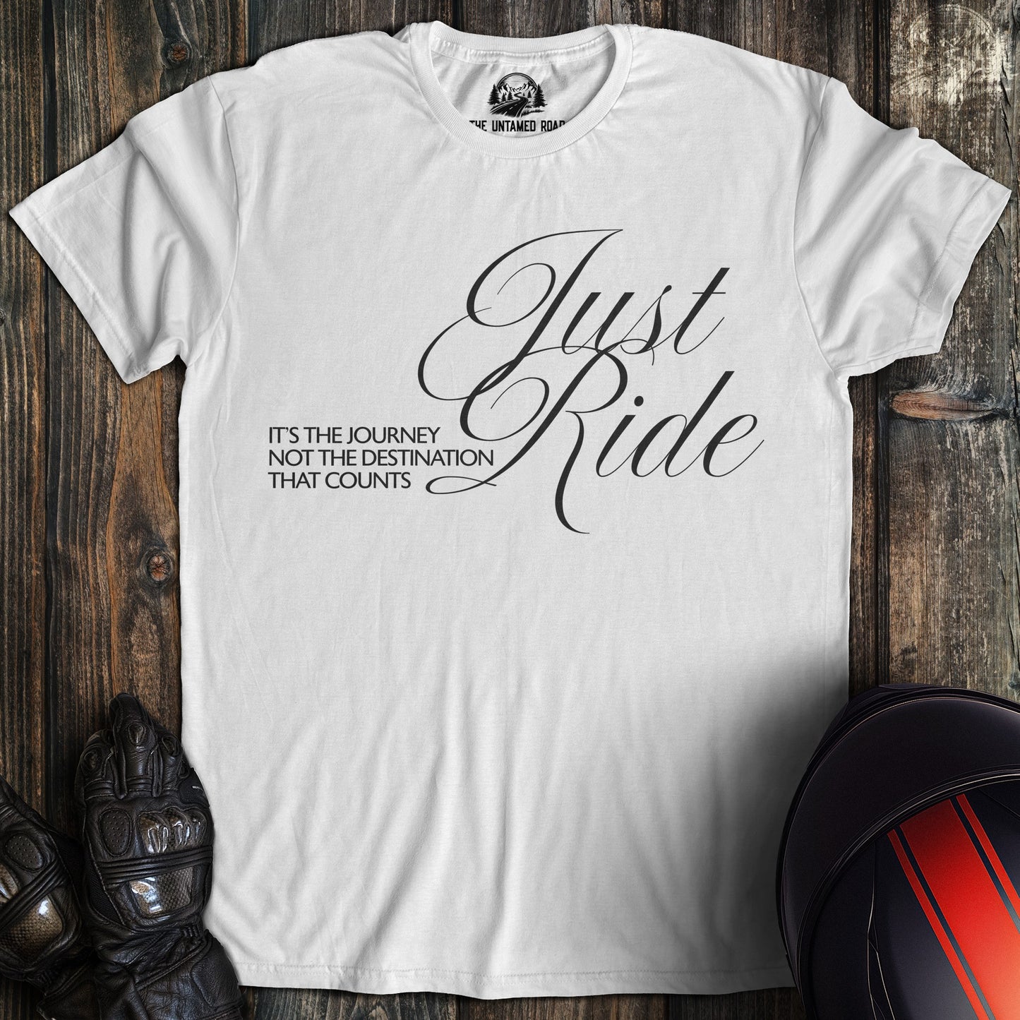 A white colored t-shirt with the words "journey not destination" printed on the front.