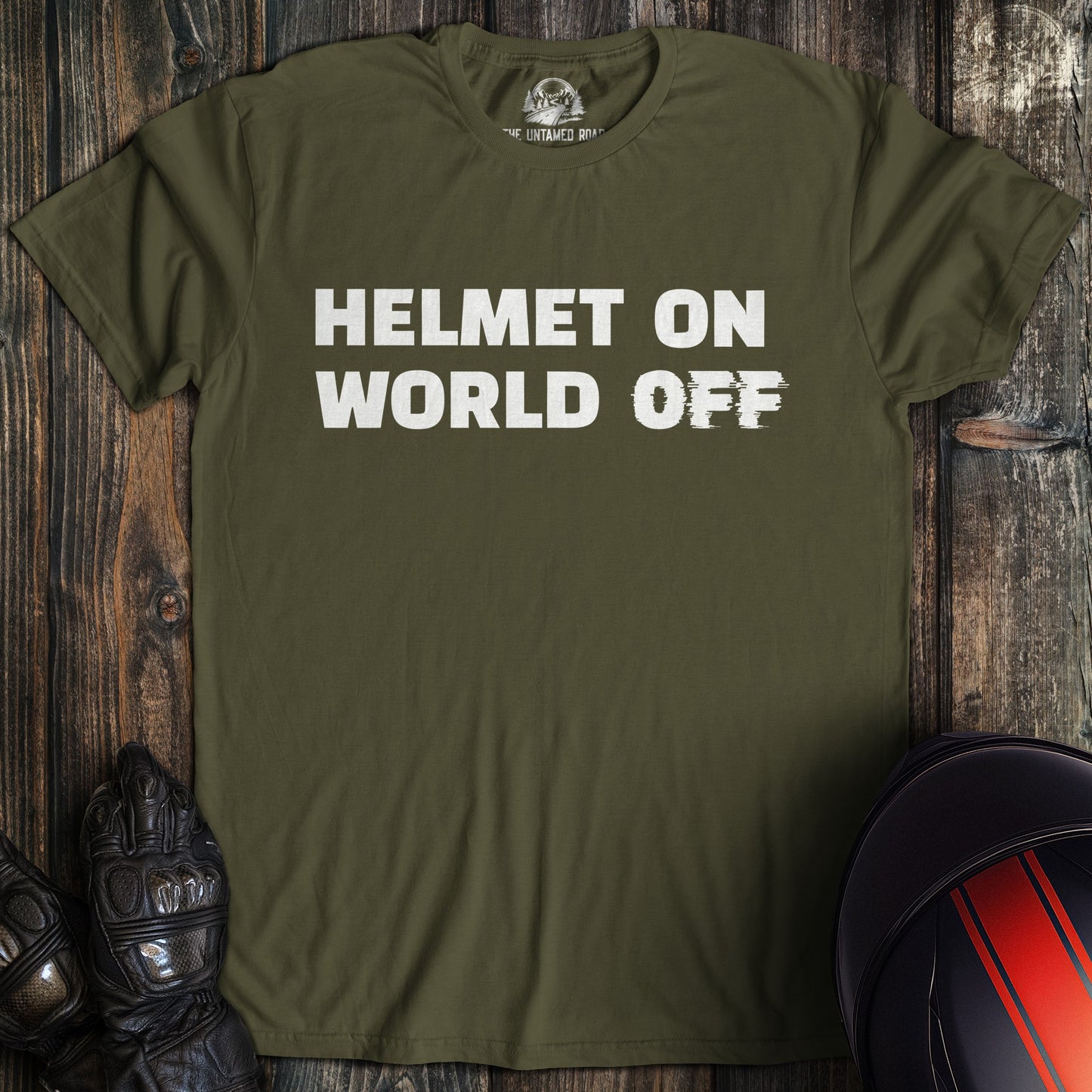 A military green colored t-shirt with the words "helmet on world off" printed on the front.