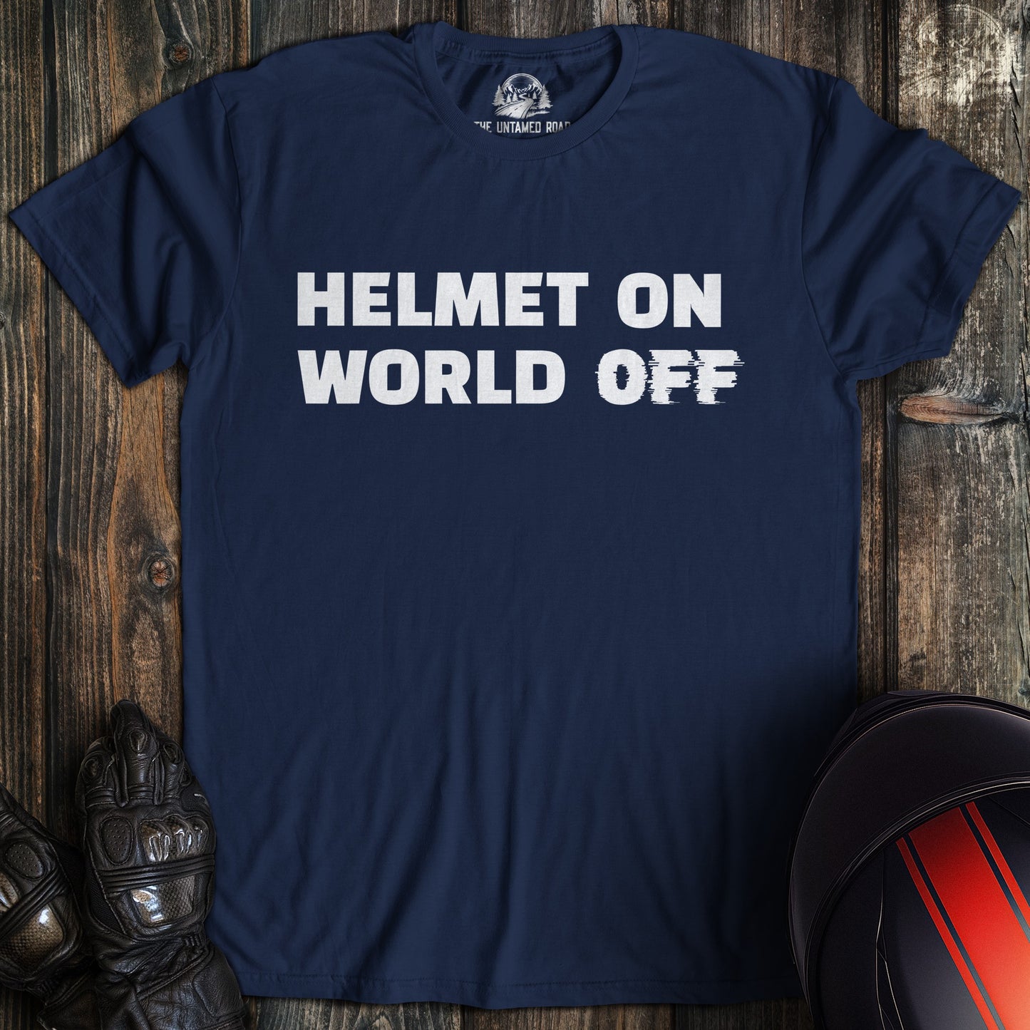 A navy colored t-shirt with the words "helmet on world off" printed on the front.