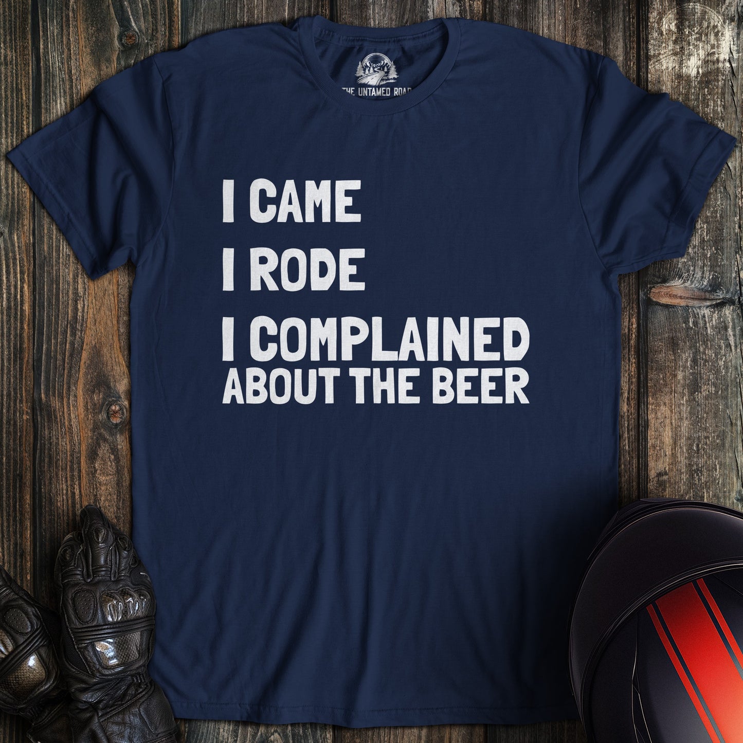 A navy colored t-shirt with the words "came rode complained" printed on the front.