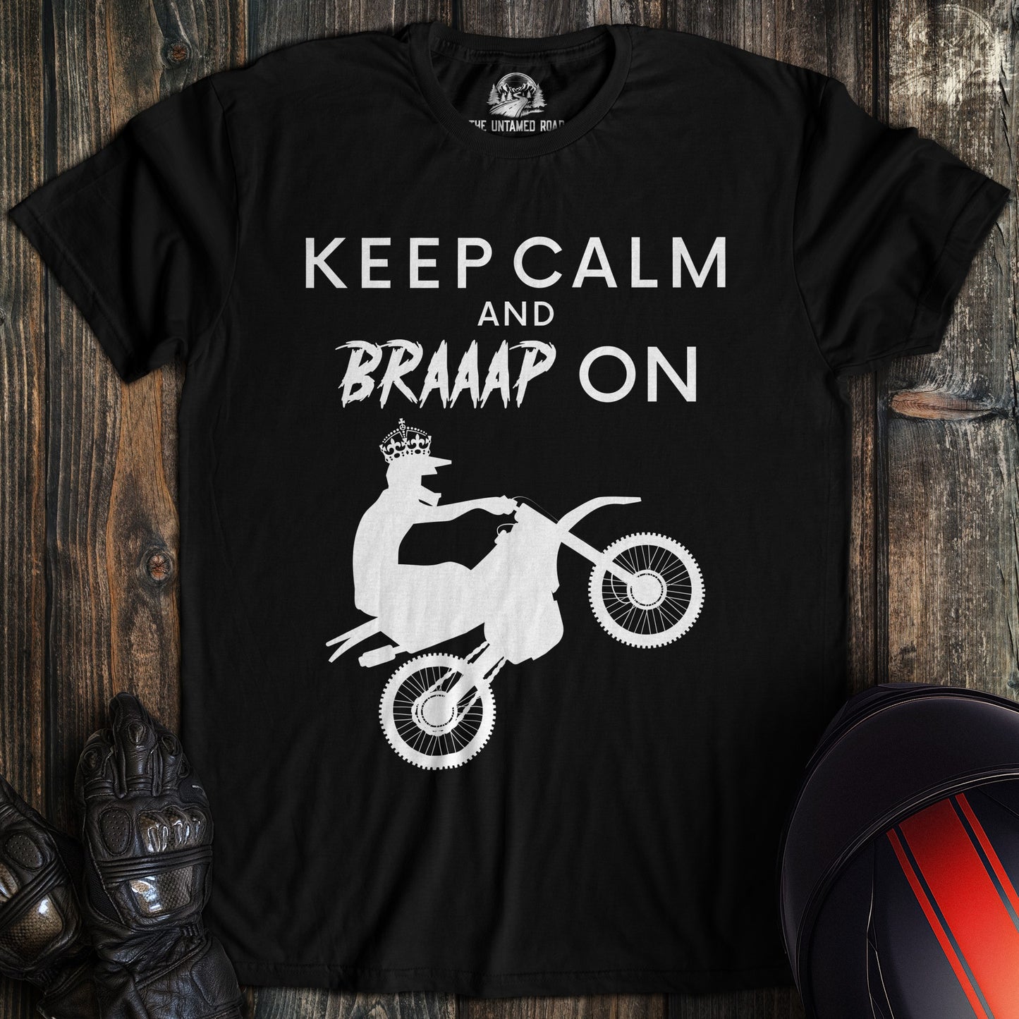 A black colored t-shirt with the words "keep calm braaap" printed on the front.