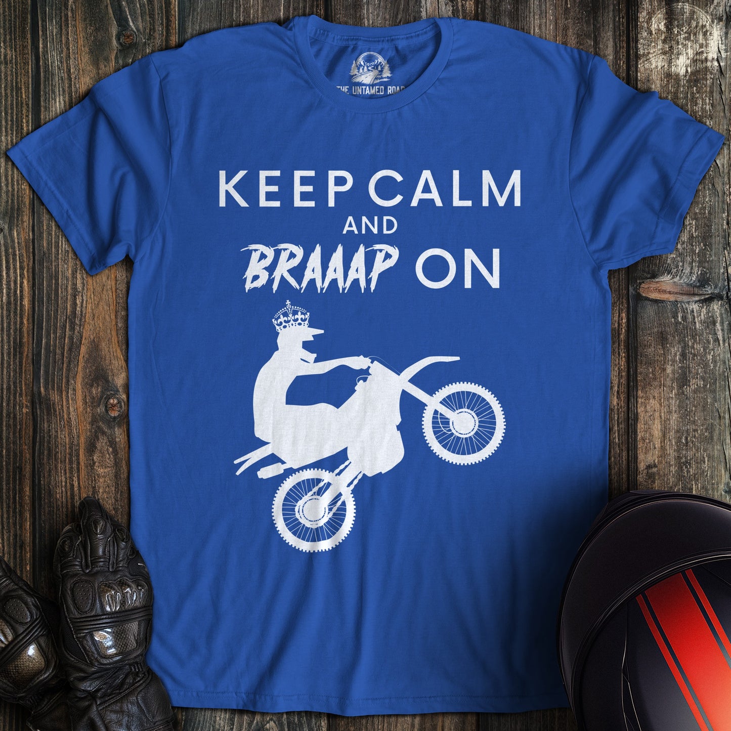 A royal blue colored t-shirt with the words "keep calm braaap" printed on the front.