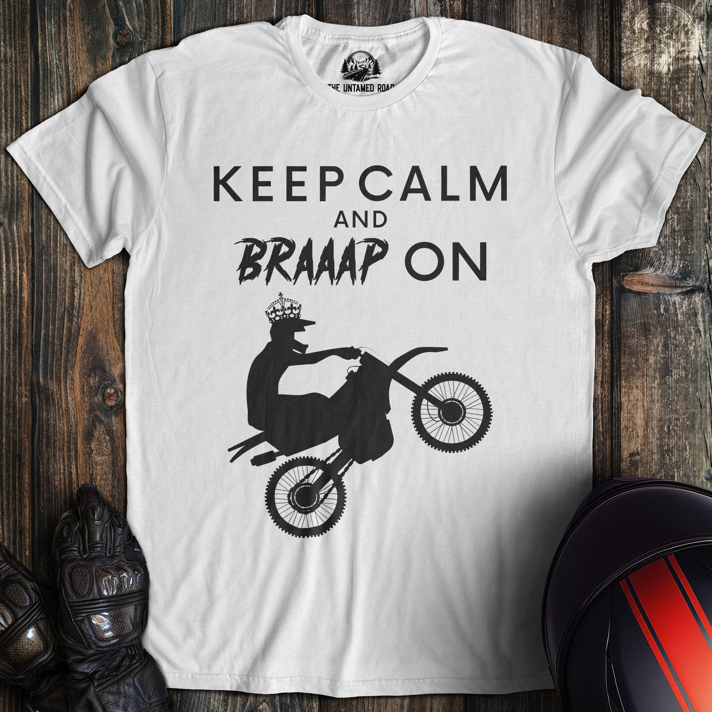A white colored t-shirt with the words "keep calm braaap" printed on the front.