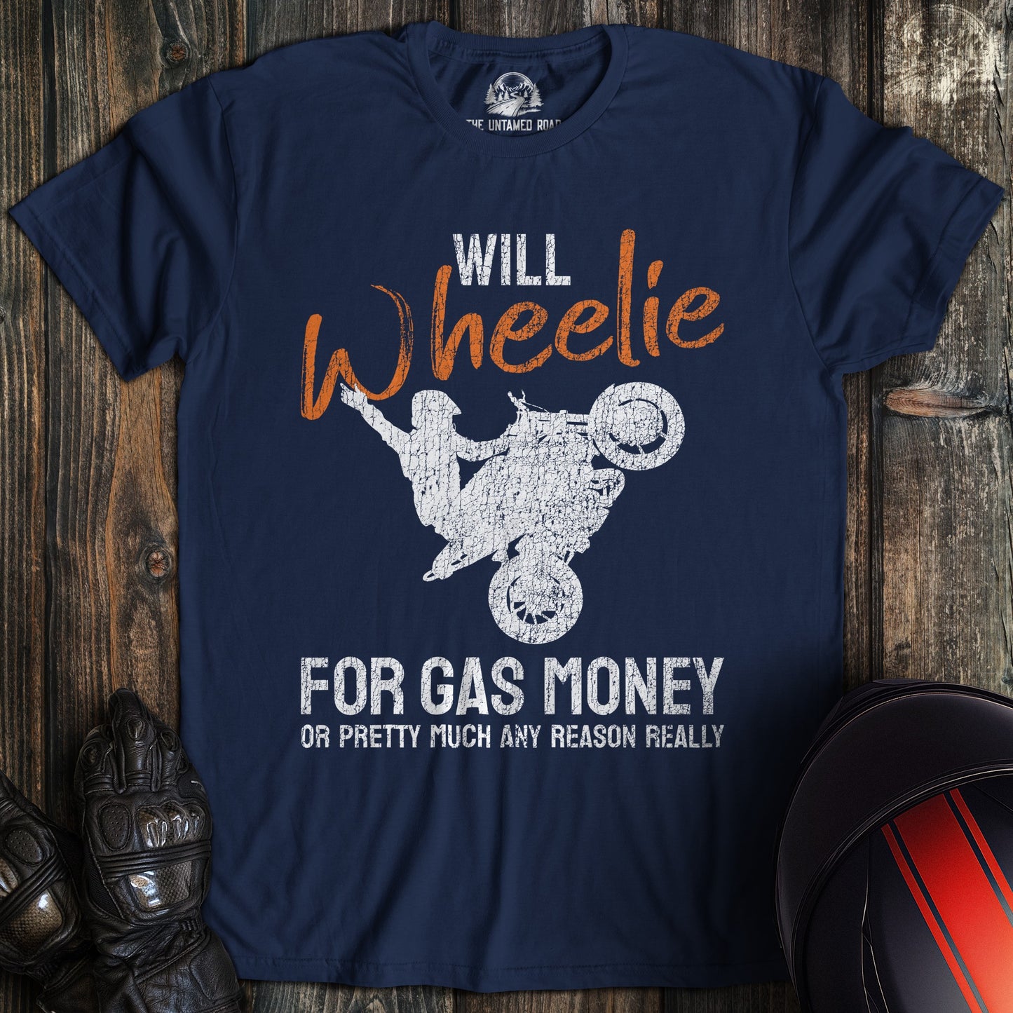 A navy colored t-shirt with the words "wheelie for money" printed on the front.