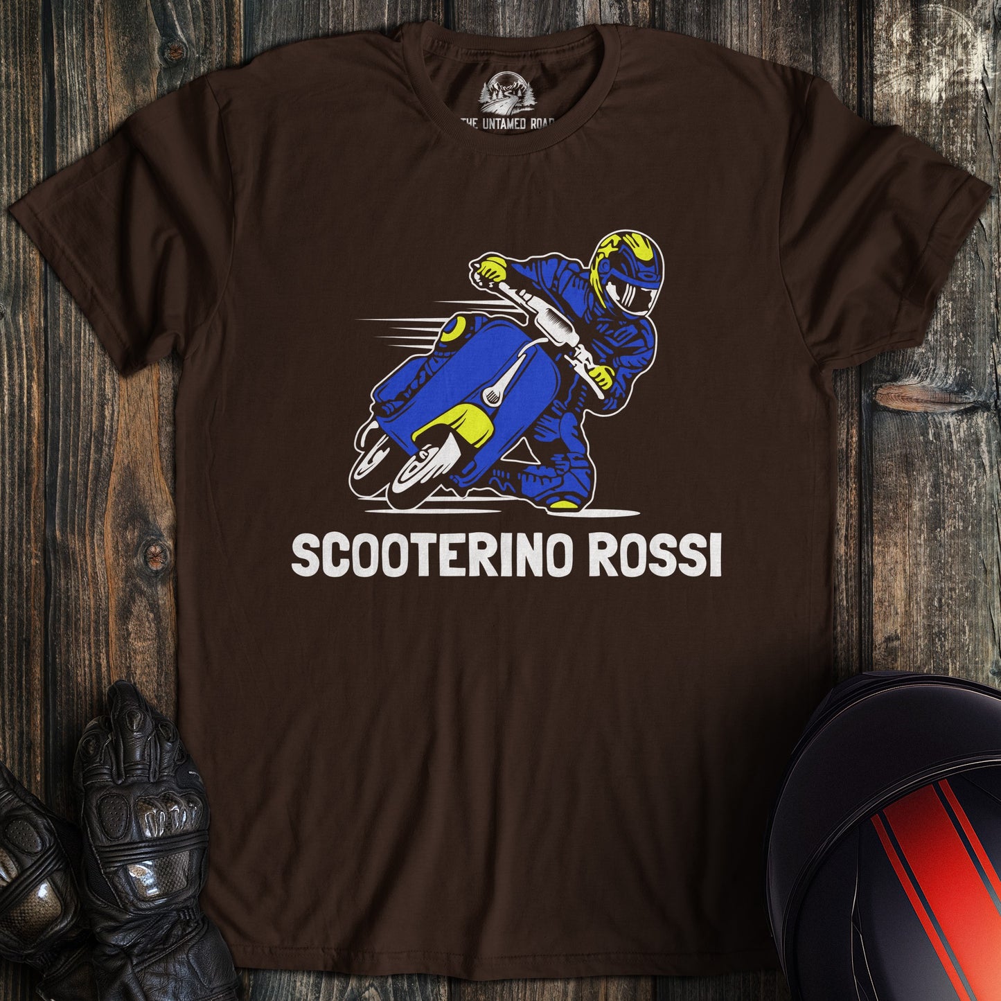 A dark chocolate colored t-shirt with the words "scooterino rossi" printed on the front.
