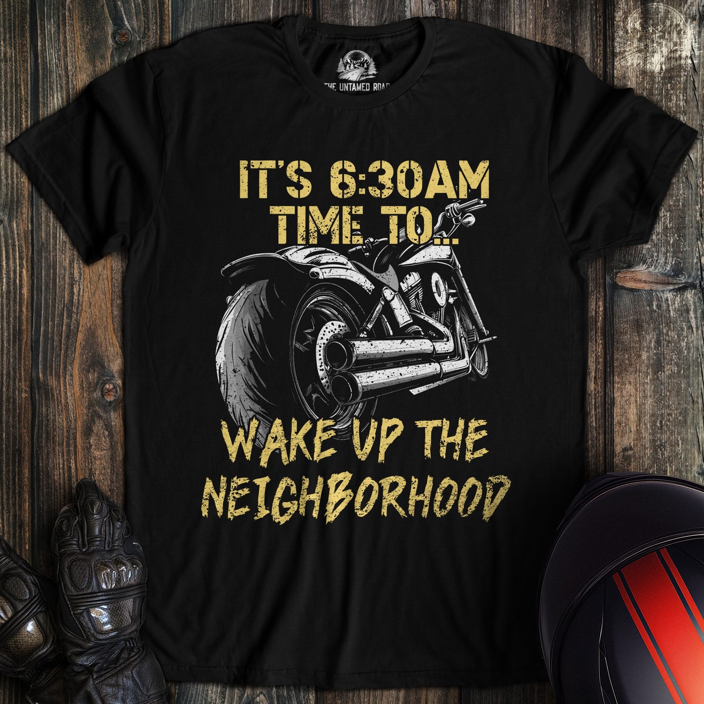 A black colored t-shirt with the words "wake the neighborhood" printed on the front.