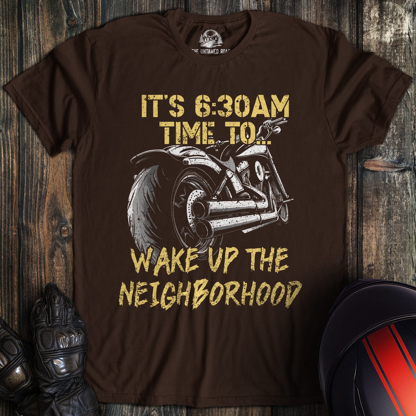 A dark chocolate colored t-shirt with the words "wake the neighborhood" printed on the front.